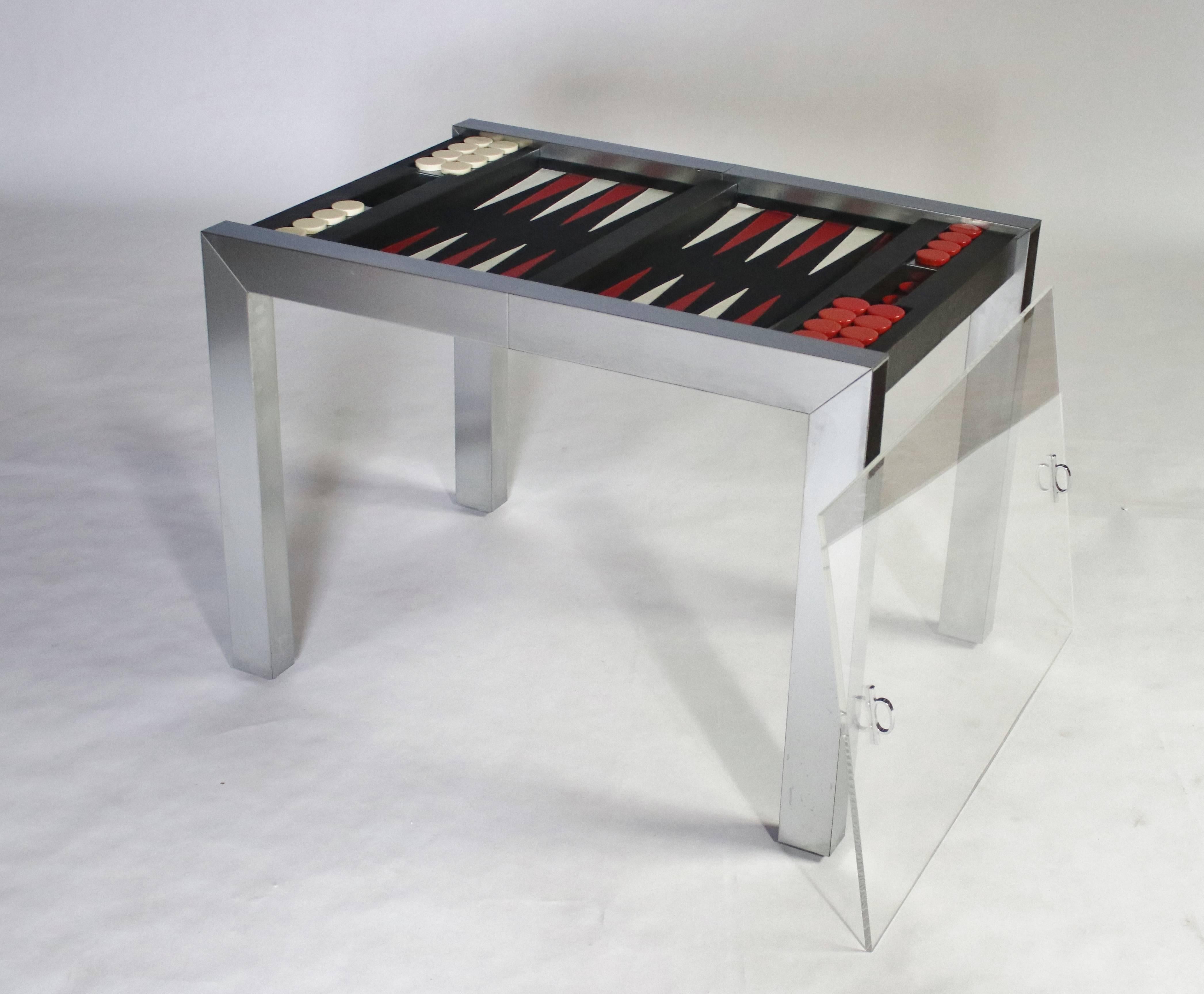 Paul Evans studio backgammon game table model P.E. 742 from the PE 800 series for Directional. Chrome-plated steel frame with leather board and acrylic playing pieces. Covered by a plexiglass slide-on top with chrome handles which fits upside down
