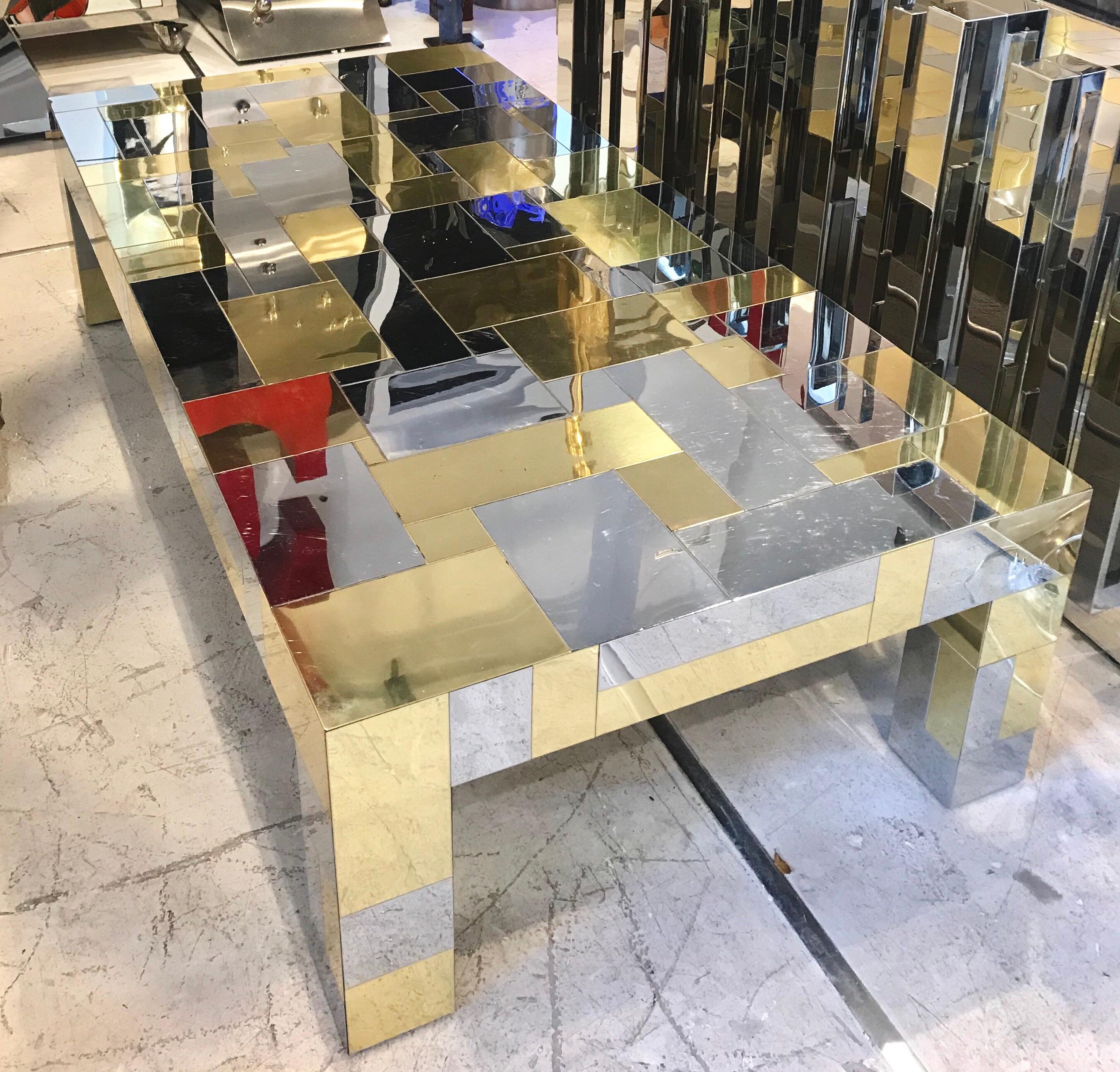 A low coffee table in an iconic patchwork Cityscape design with brass and mirror polished chrome signed Paul Evans.