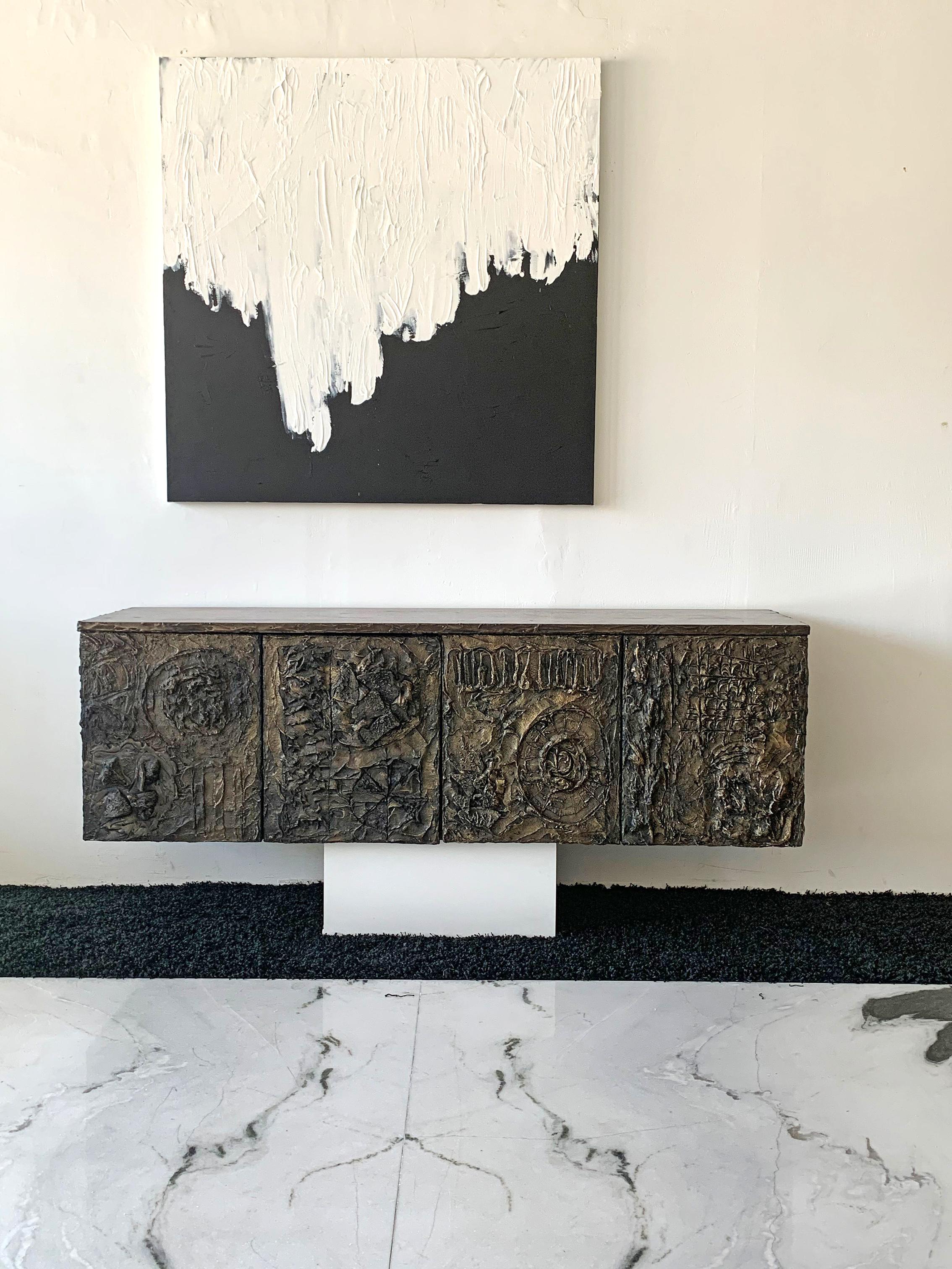 This piece is incredible! A sculpted cast bronze cabinet by Paul Evans for Directional furniture. This 
