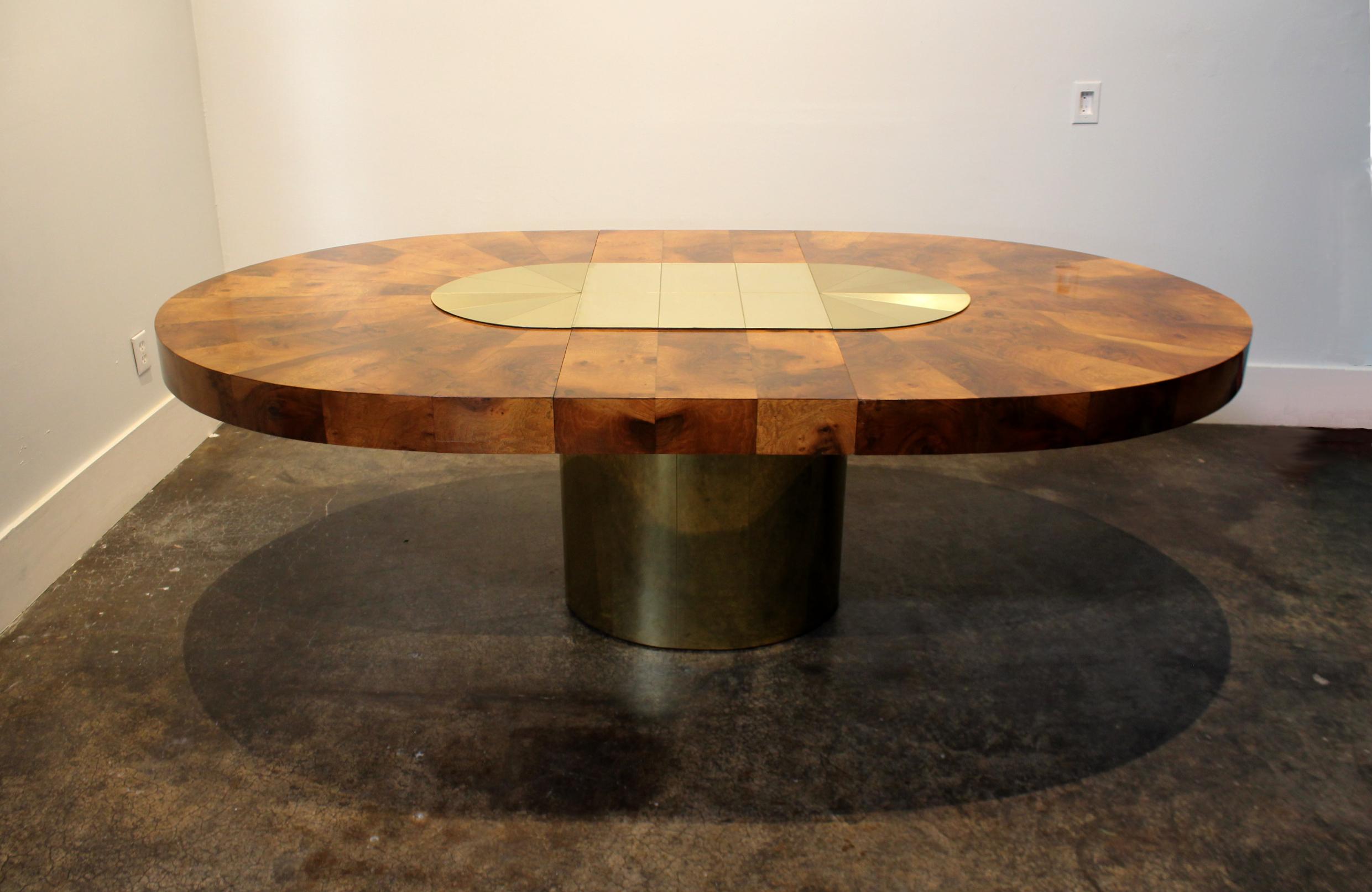 Stunning dining table by Paul Evan with beautiful sunburst brass and wood design. The wood and brass positively glow, circa 1970s. Table is in good condition with light wear (see pictures of worst spots).

Measurements:
92 1/2