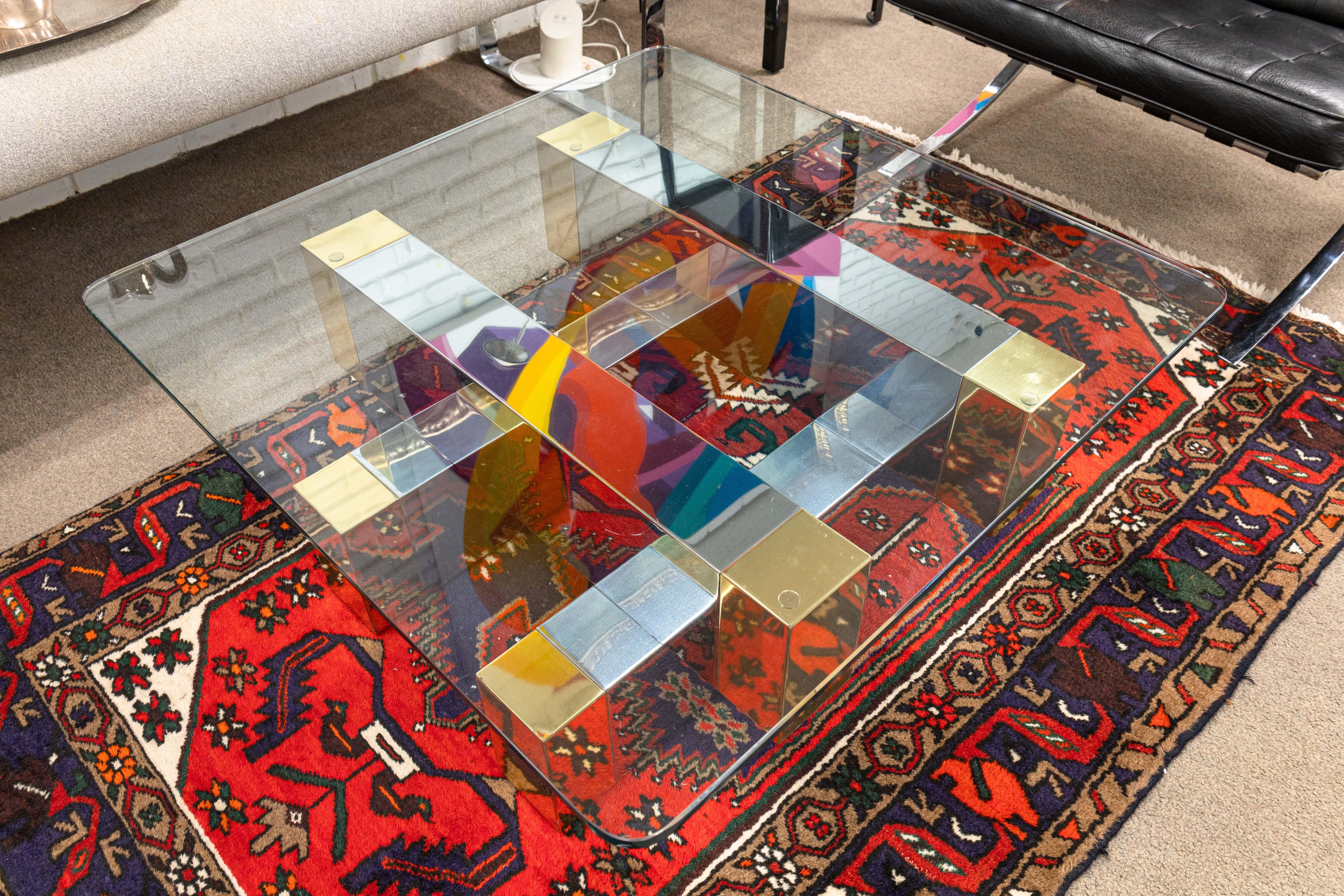 A Paul Evans for Directional Cityscape style coffee table. This gorgeous mid century modern coffee table takes inspiration from the legendary Paul Evans Cityscape series of furniture. This piece features a rounded square glass table top, and a