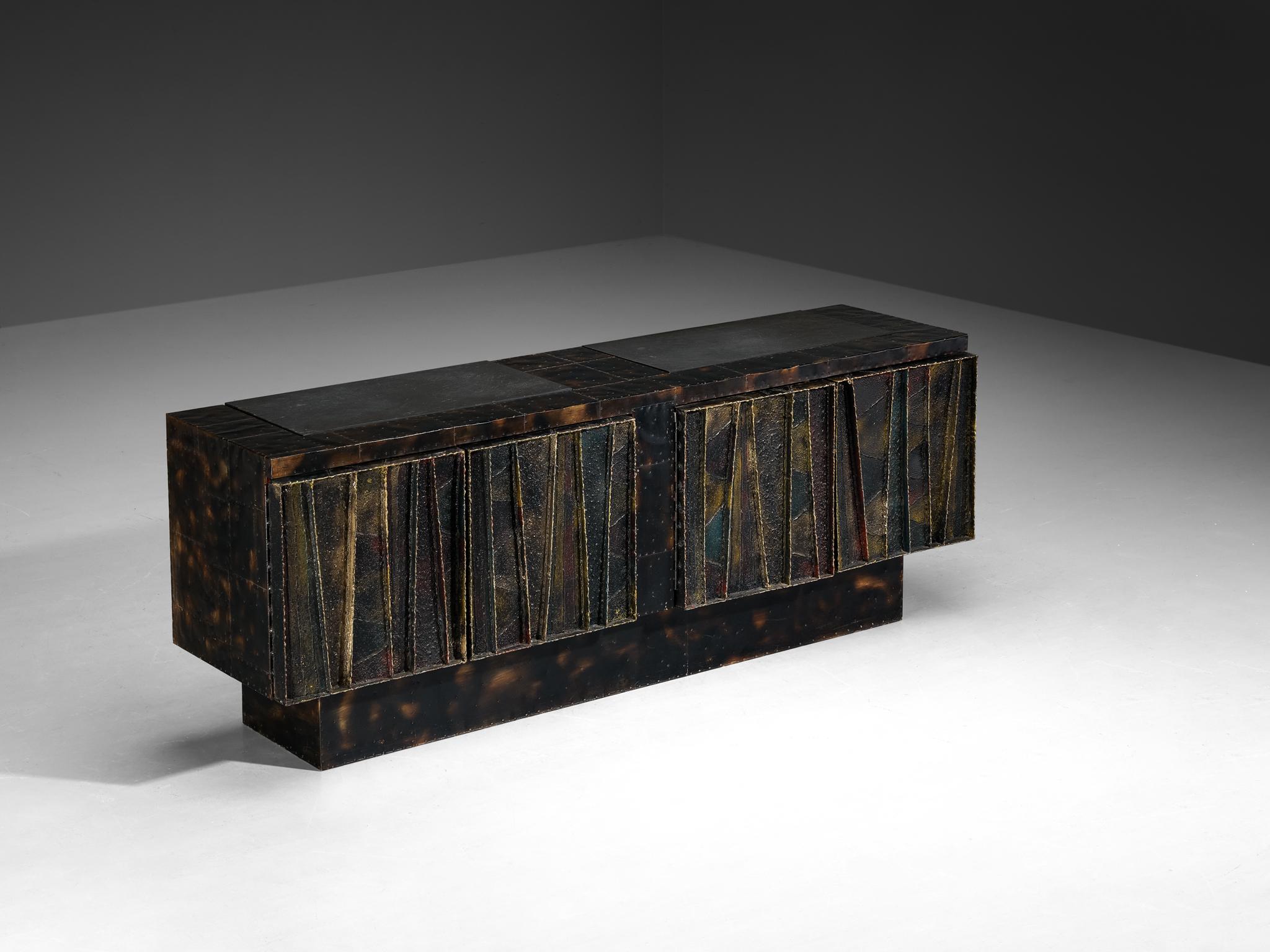 Paul Evans for Directional, 'PE-42' sideboard, welded steel, painted wood, cleft slate, United States, 1970s

An exceptional design by Paul Evans undeniably breathes artistic excellence combined with impeccable craftsmanship. This piece exemplifies