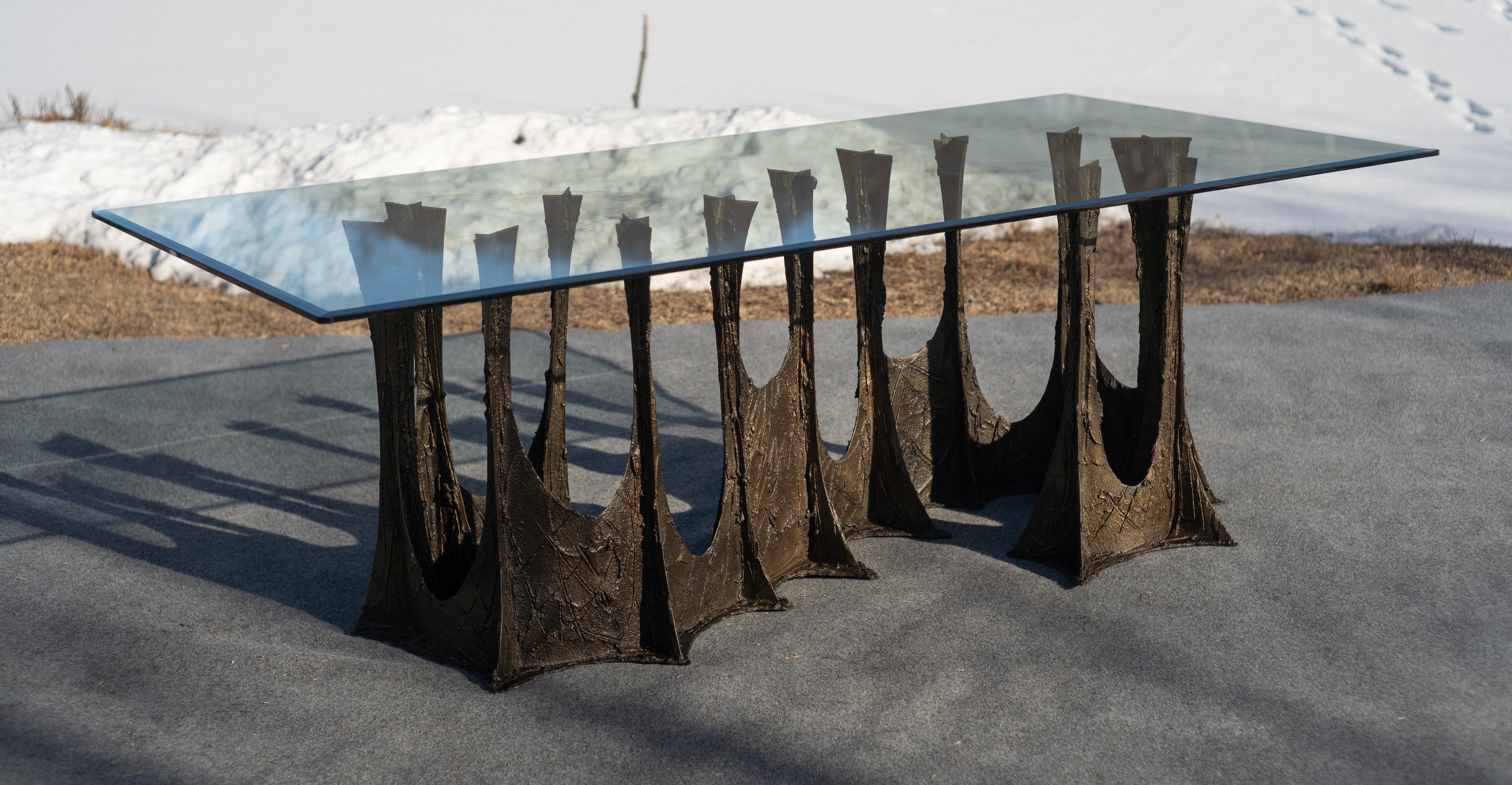 Made by American Design icon Paul Evans, this table was sold by Directional after production in 1972. At this point in his career, Evans had perfected his formula. The sculptured bronze line strikes the perfect balance between rare/studio-made and