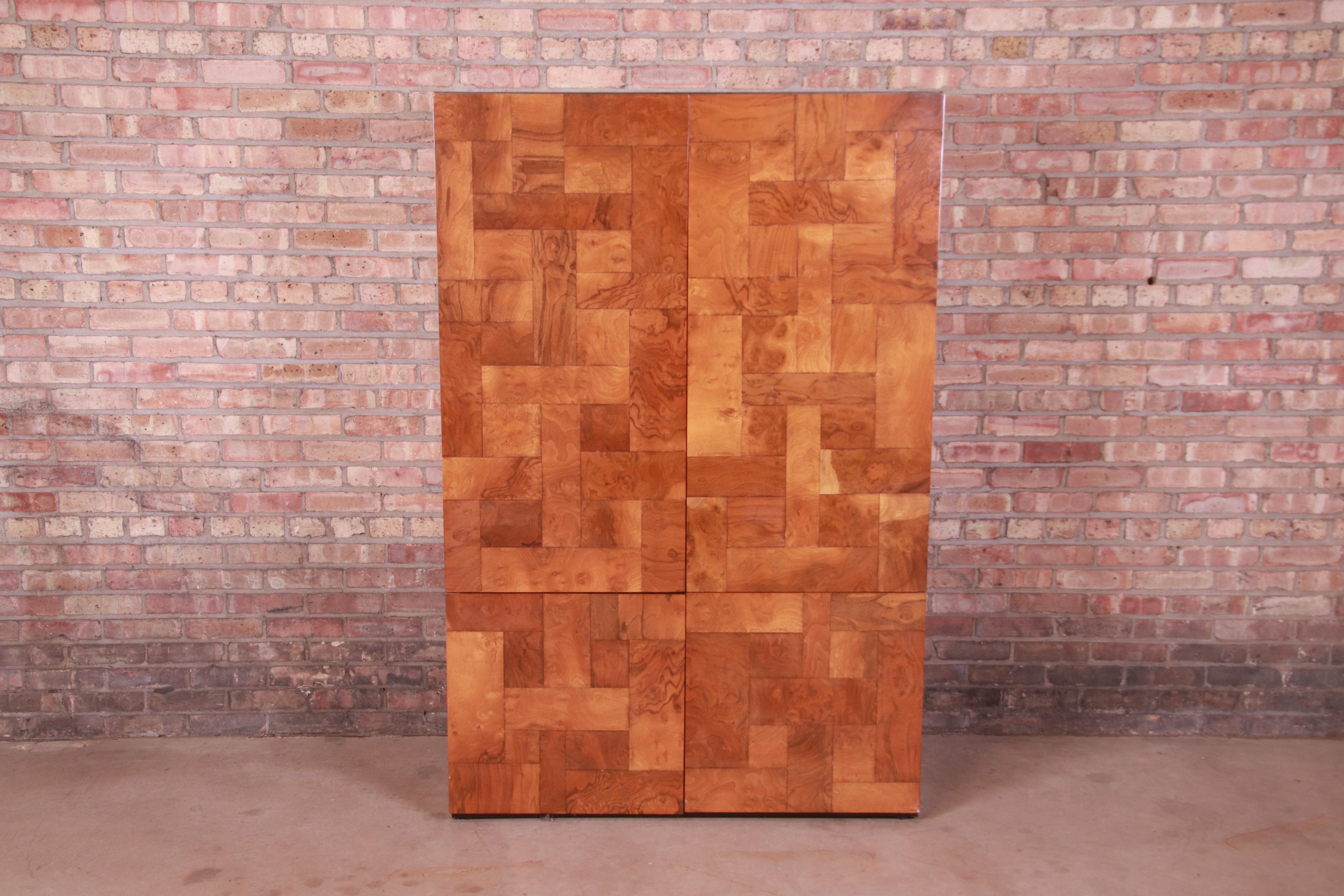 An exceptional Mid-Century Modern patchwork burl wood, armoire dresser, bookcase, or bar cabinet

By Paul Evans for Directional, 