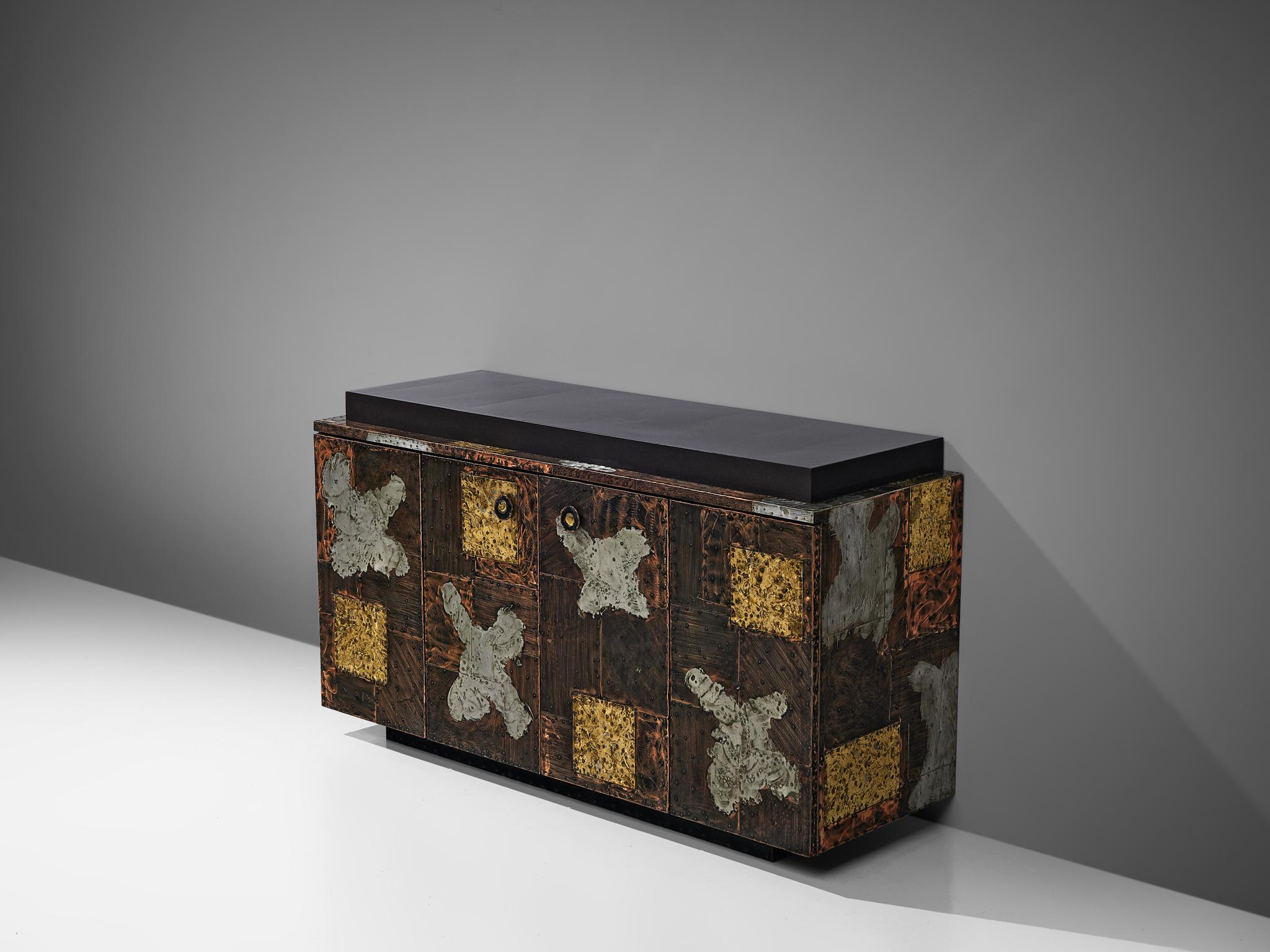 Paul Evans for Directional, 'Patchwork' sideboard, wood, fiberglass, copper, steel and brass, United States, 1960s

Unique sideboard designed by Paul Evans for Directional furniture. The wheeled cabinet is made of copper, steel and brass and