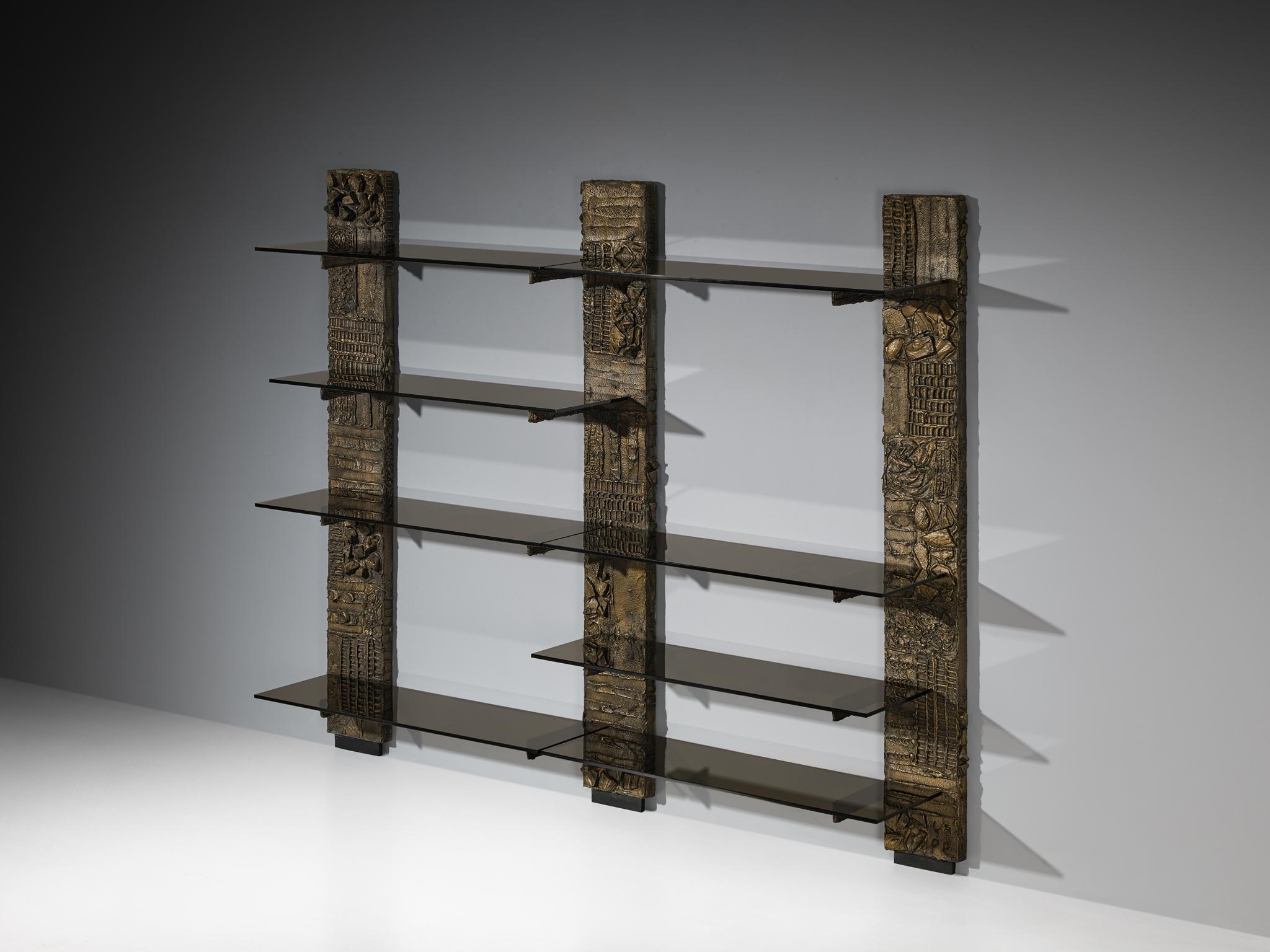 Paul Evans for Directional, wall shelves, model 'PE 68', epoxy bronzed resin over wood, smoked glass, United States, 1970s

Grand wall unit by Paul Evans, designed for Directional in the 1970s. This striking piece of 20th-century design history