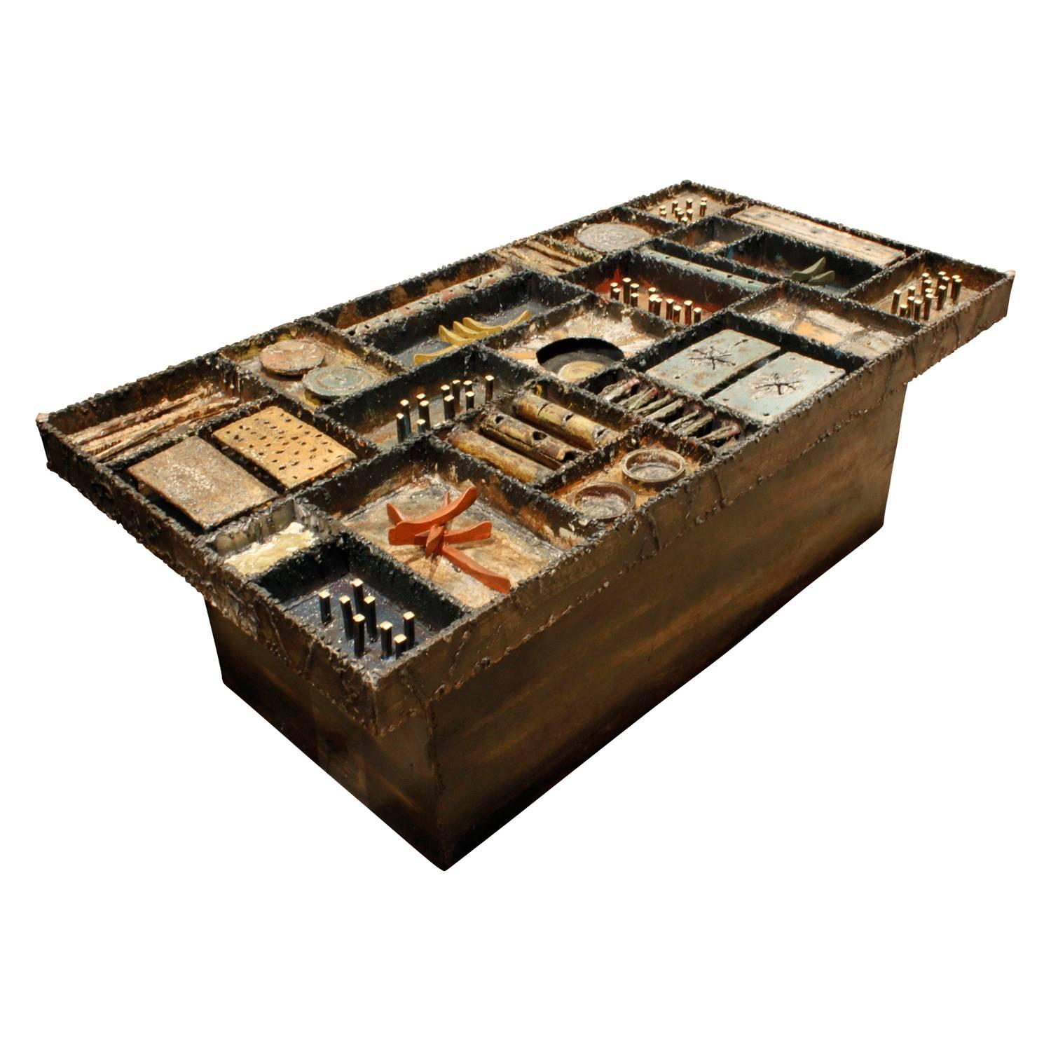 Important and rare “Sculpture Top Coffee Table” in welded and patinated steel, color pigments, 24 karat gold leaf with glass top by Paul Evans, American 1973 (signed “Paul Evans 73’ on side). This was custom made to be a coffee table—it is extremely