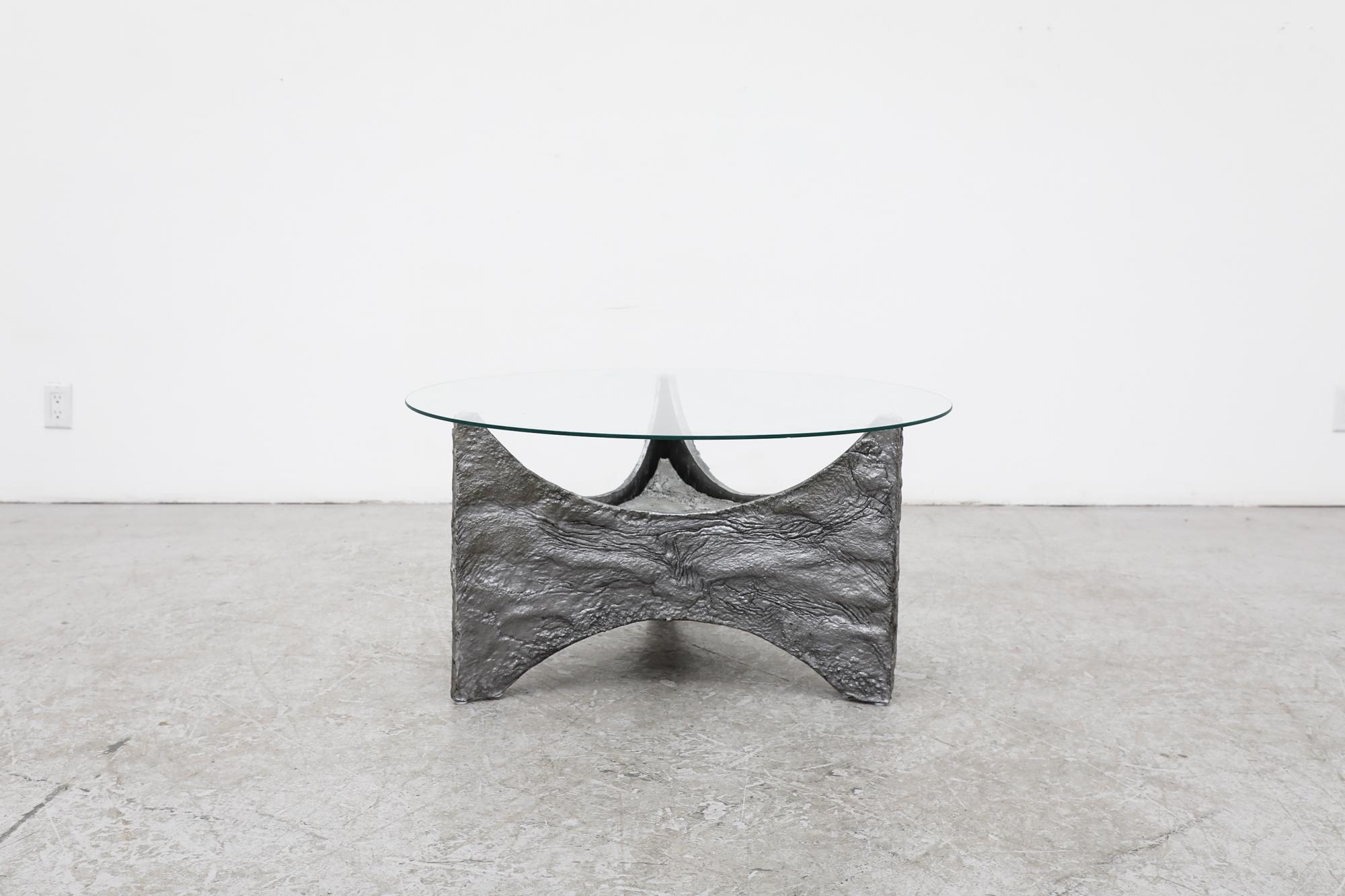 Brutalist Paul Evans inspired vintage coffee table with new round glass top and sculptural base. Black feet pads on base. In original condition with visible wear consistent with its age and use.