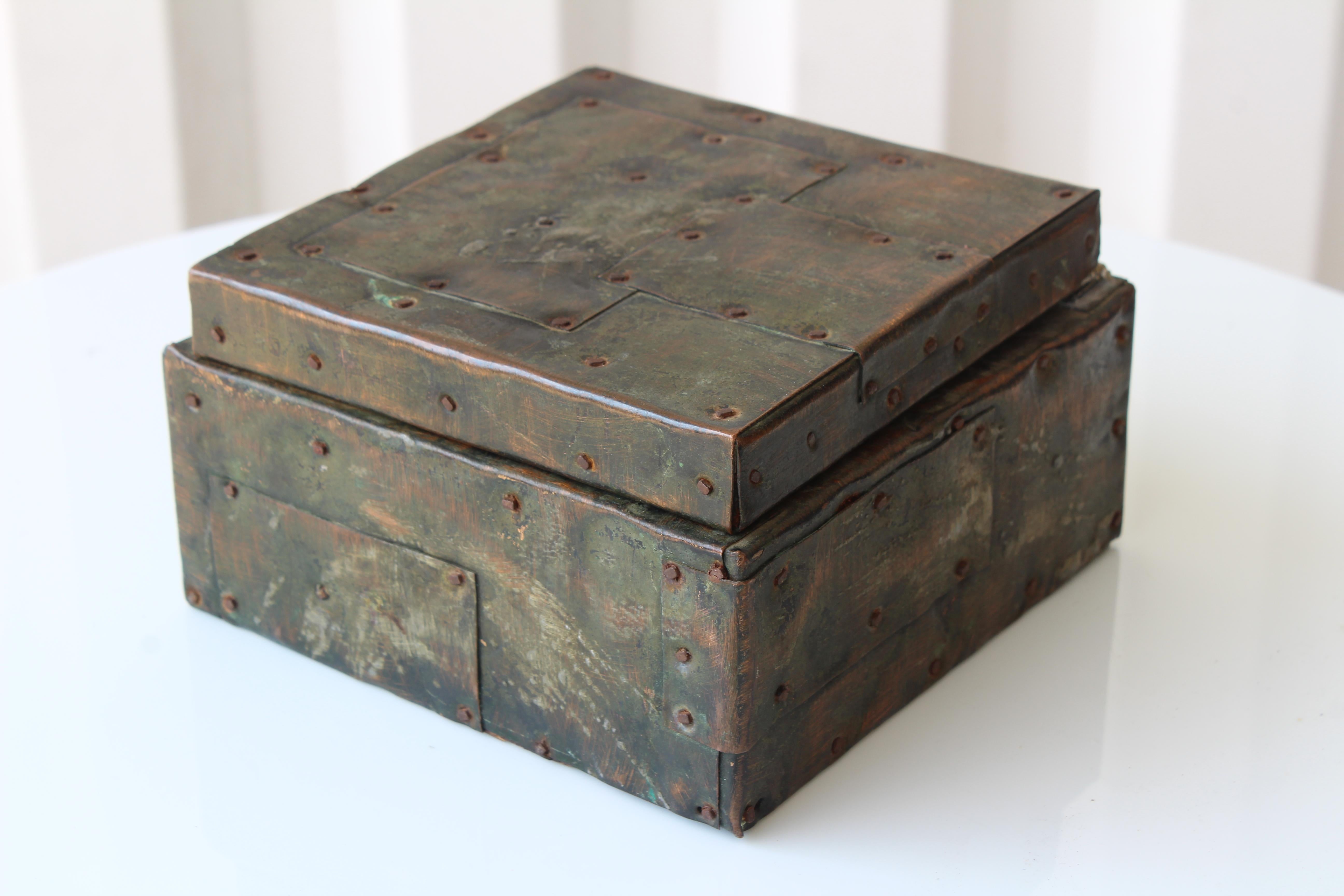 Metal clad lidded box by Paul Evans, U.S.A, 1965. Brass, copper and steel. Shows age appropriate wear with some cork missing in the interior of the box.