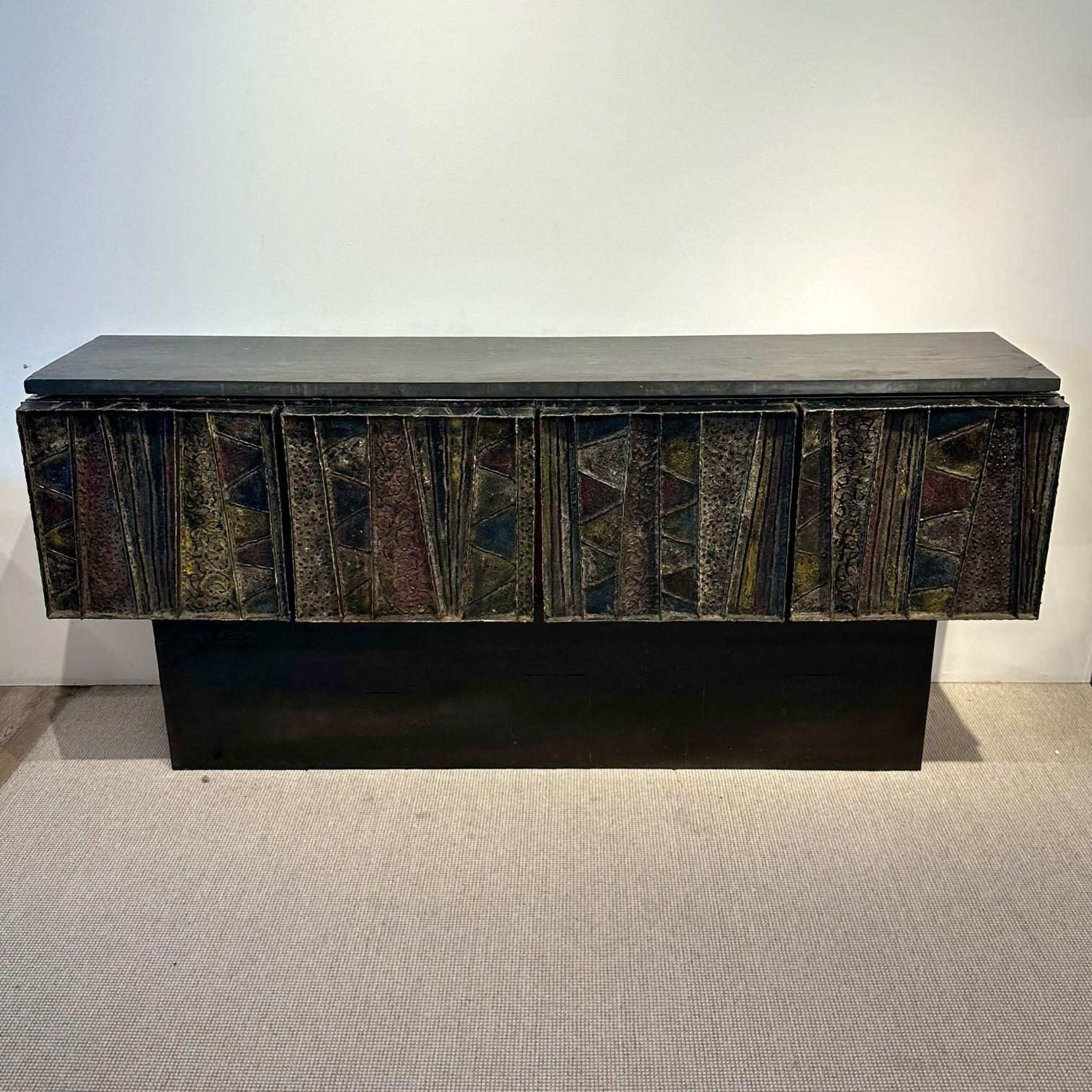 Paul Evans Mid-Century Modern Brutalist Deep Relief Credenza / Sideboard, Signed
 
Handcrafted Paul Evans (American, 1927-1993) 'Deep Relief' Credenza designed and produced in 1967; inscribed on the underside of the left hand door. A rare and