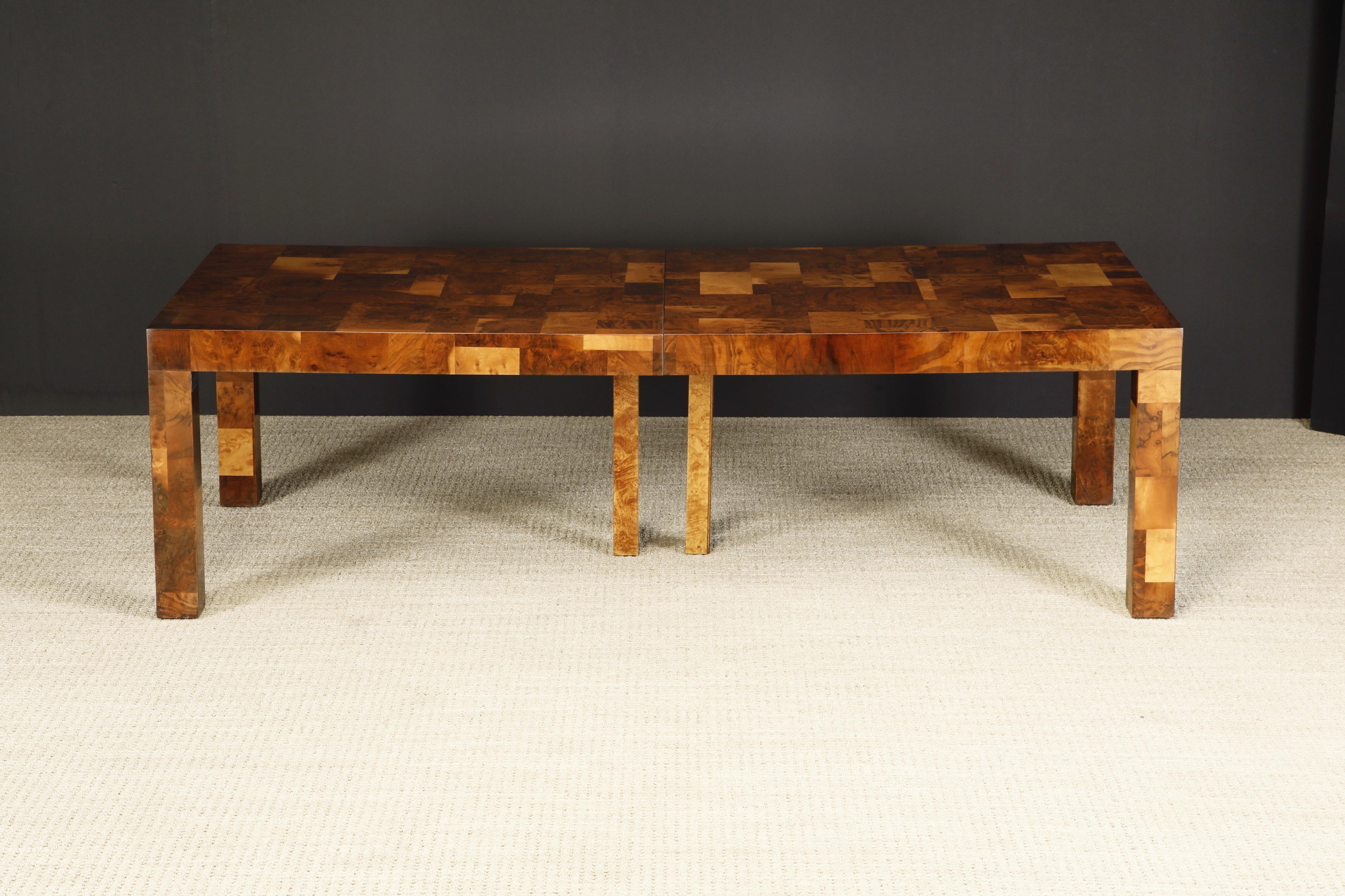 This monumental 'Cityscape II' expandable dining table with two leaves by Paul Evans for Directional Furniture, circa 1974, featuring a mesmerizing array of patchwork walnut burl and olive burl, was just refinished in a beautiful French Polish and