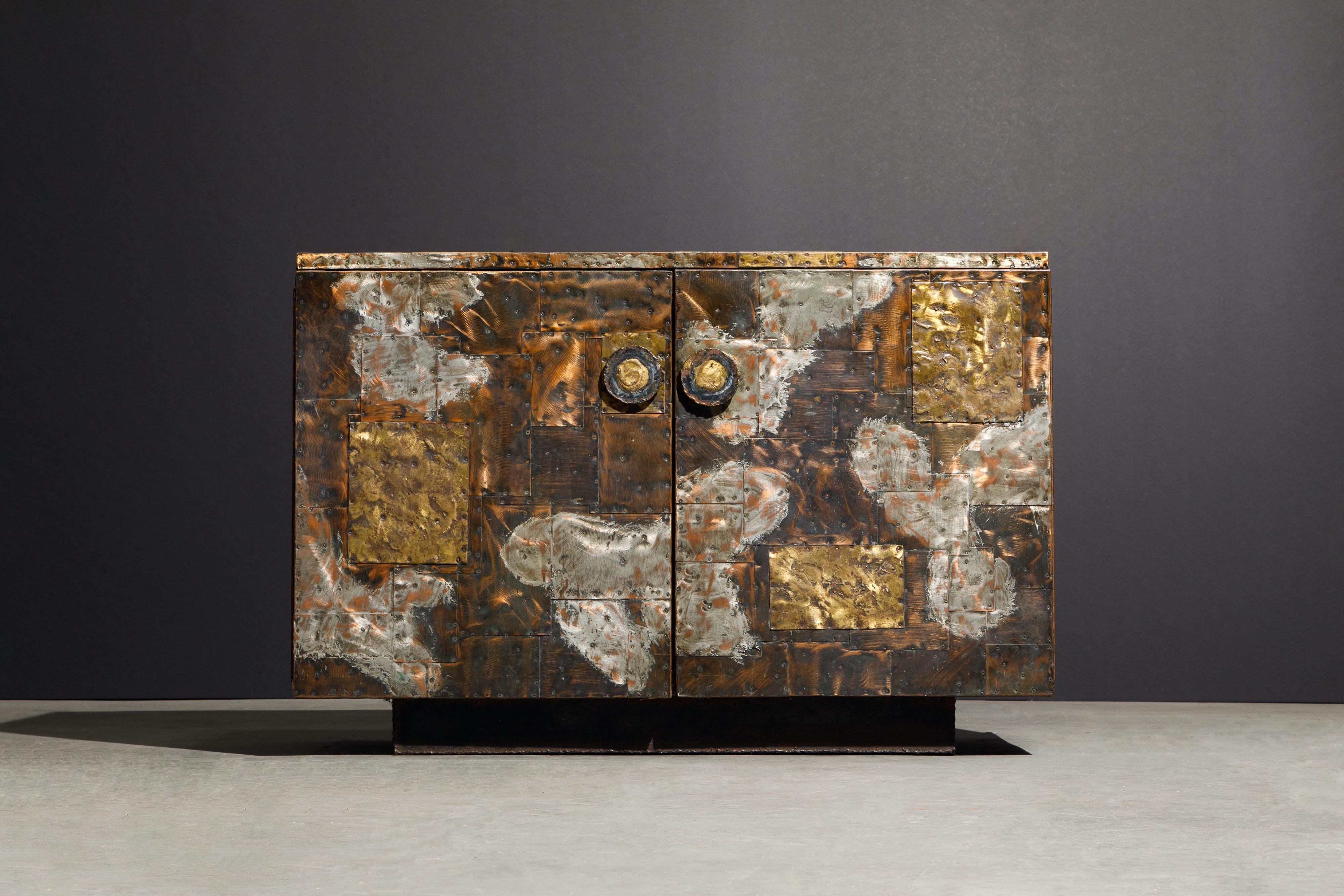Stunning and rare copper clad sideboard cabinet by Paul Evans for Directional, produced in circa 1967. This incredible piece of design history is fabricated from patinated pieces of copper, brass, and pewter which have been welded and nailed in a