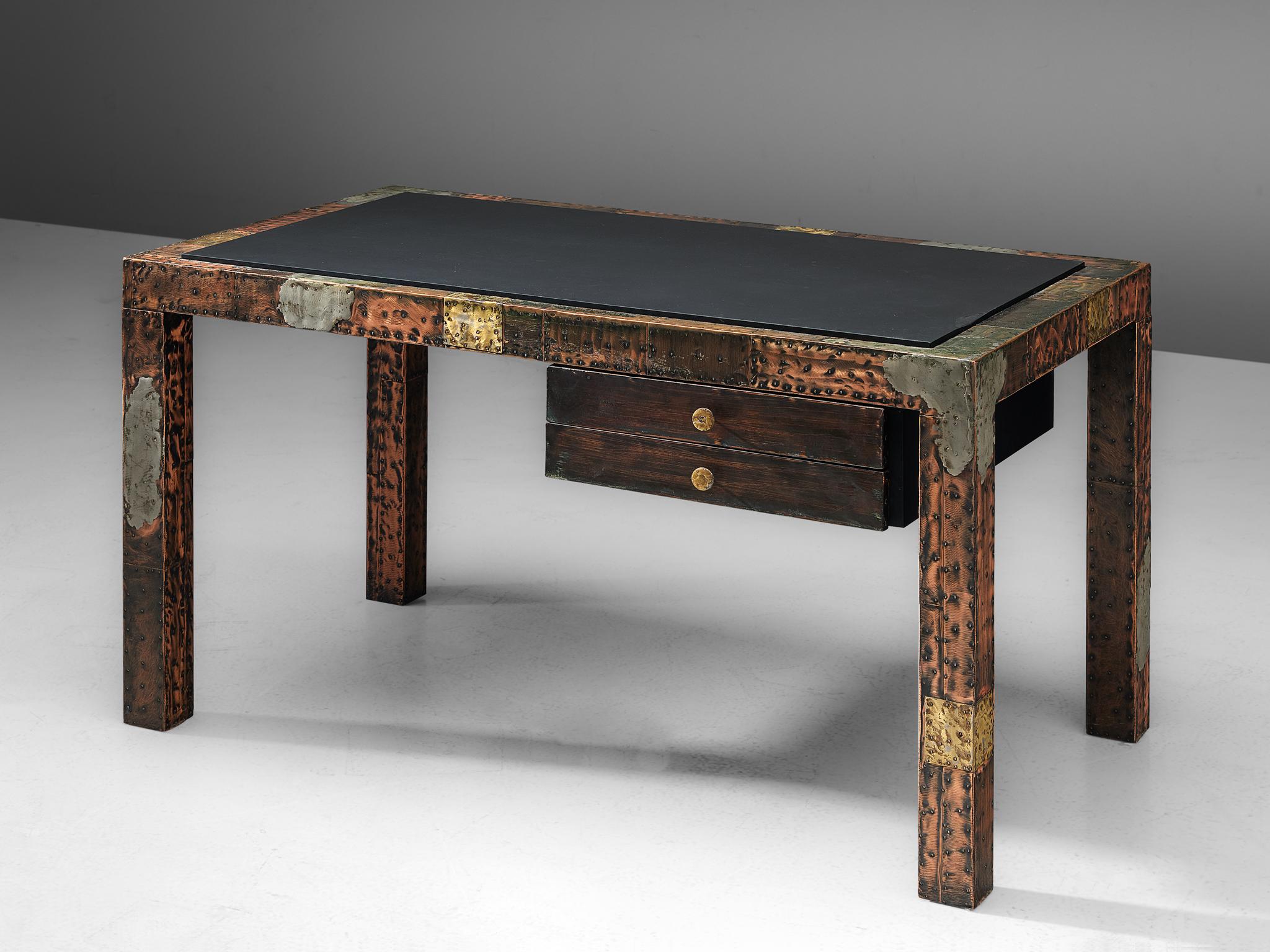 Paul Evans, patchwork desk, copper, brass, pewter, slate, United States, 1970s.

This patchwork desk by Paul Evans for Directional, is made out of different metals and a black slate tabletop. The colors differ from the reddish brown copper to