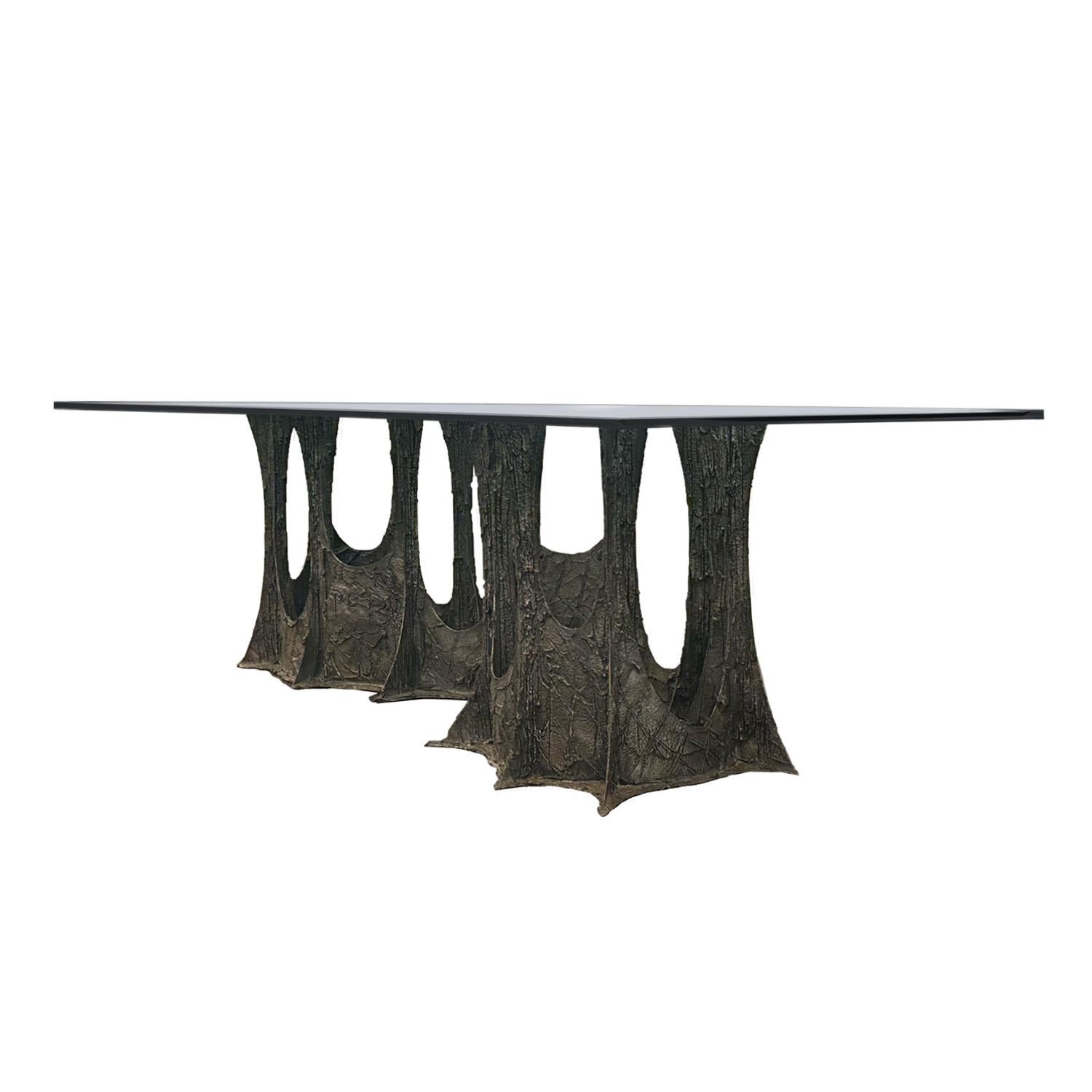 Hand crafted epoxy and atomized bronze applied over steel, dining table base with thick glass top. This iconic table combining traditional craft with experimental materials is signed and dated PE 73 on the lower left portion of base. Can accept a