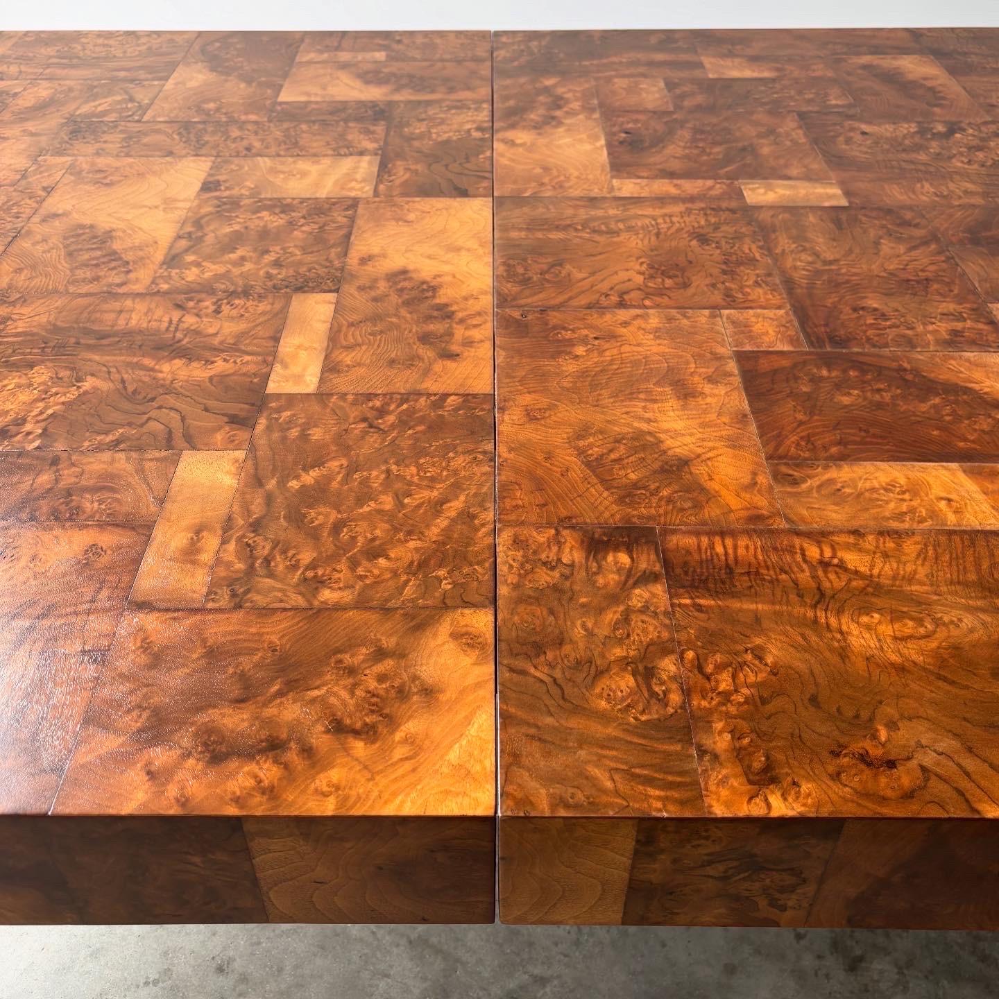 
This striking Paul Evans PE-509 dining table by Directional Furniture showcases the designer's masterful patchwork walnut burl construction. The table features Evans' signature technique of piecing together richly figured walnut burl veneers in an