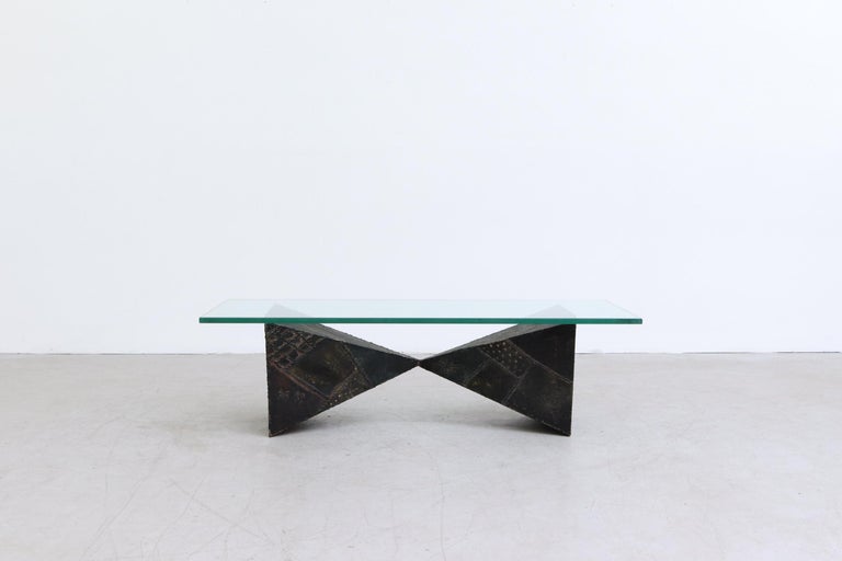 Paul Evans Brutalist Welded Bowtie coffee table with painted body and glass top. Marked PE 68. Made in 1968. In original condition with visible wear including scratches and chips to glass. Glass measures 55 x 23.625 x 0.75. Base measures 40 x 15.125