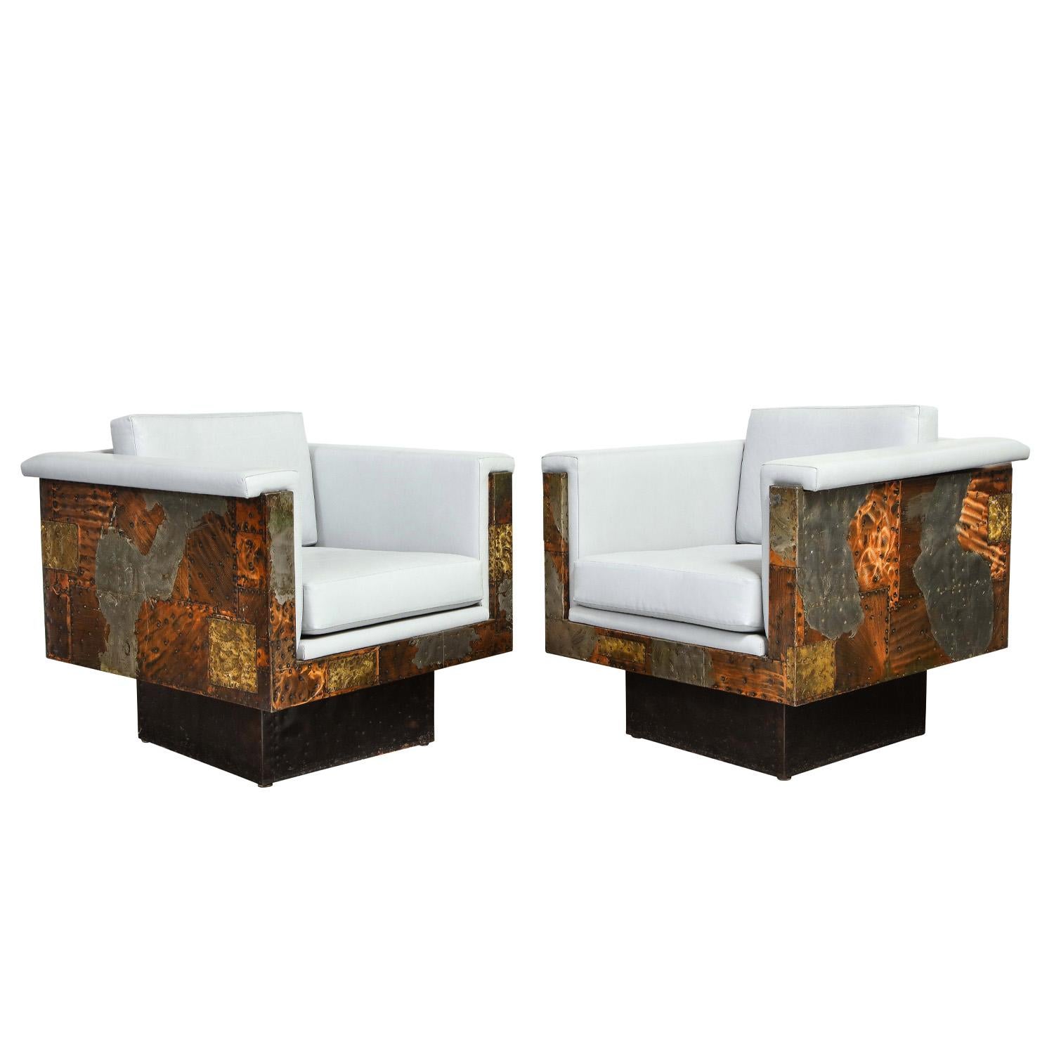 Pair of rare swiveling patchwork cube lounge chairs in hand-welded bronze copper and steel on ebonized wood bases by Paul Evans Studio for Directional, 1970's. These chairs are works of art by one of the 20th century’s most important designers.