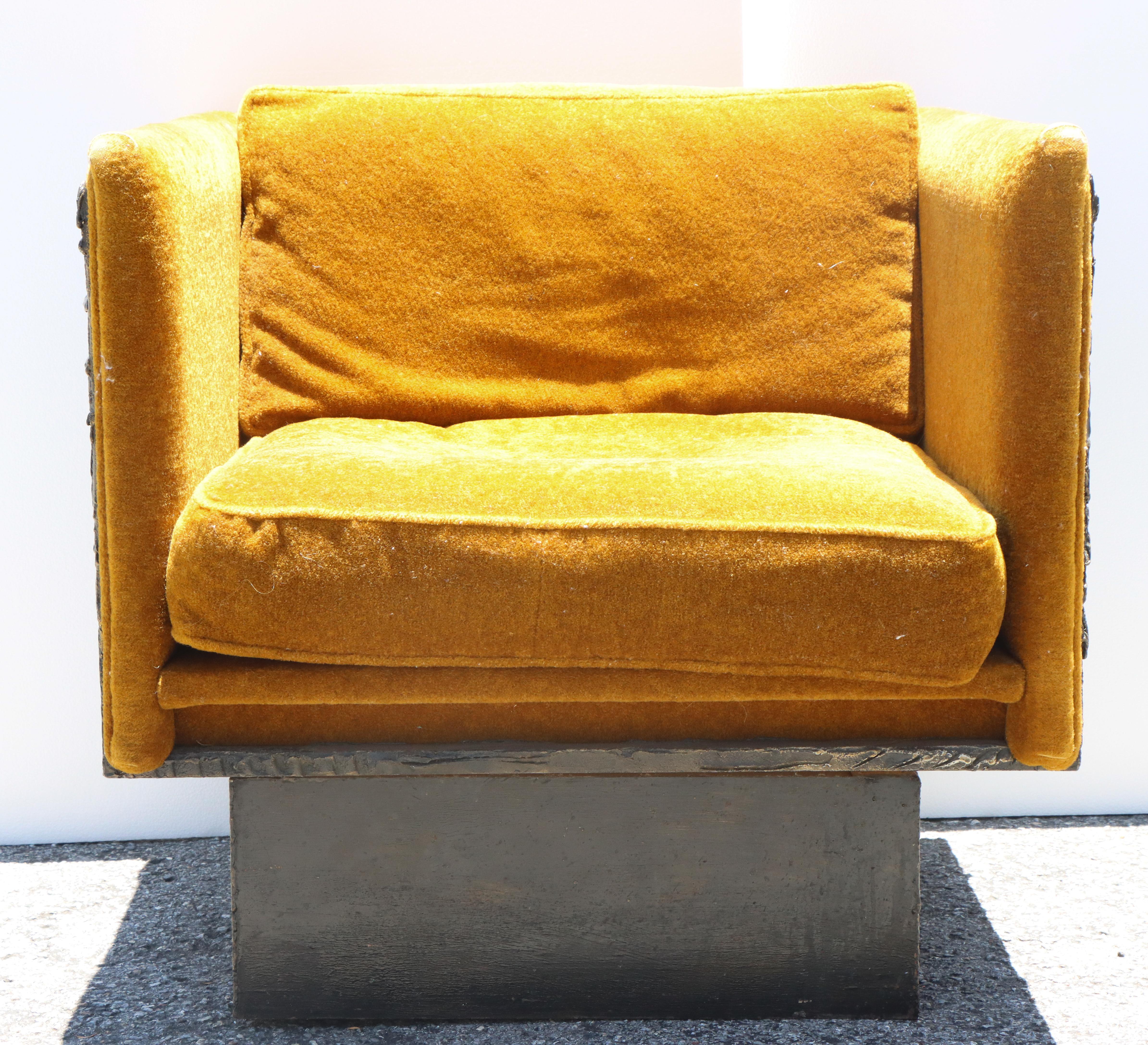 Paul Evans (1931-1987), Sculpted Bronze Brutalist Swivel Chair 1969. This is the only chair in this style we can find having ever been sold at auction. Orange velvet upholstered cube lounge swivel chair with brutalist bronze sides. Chair is signed.