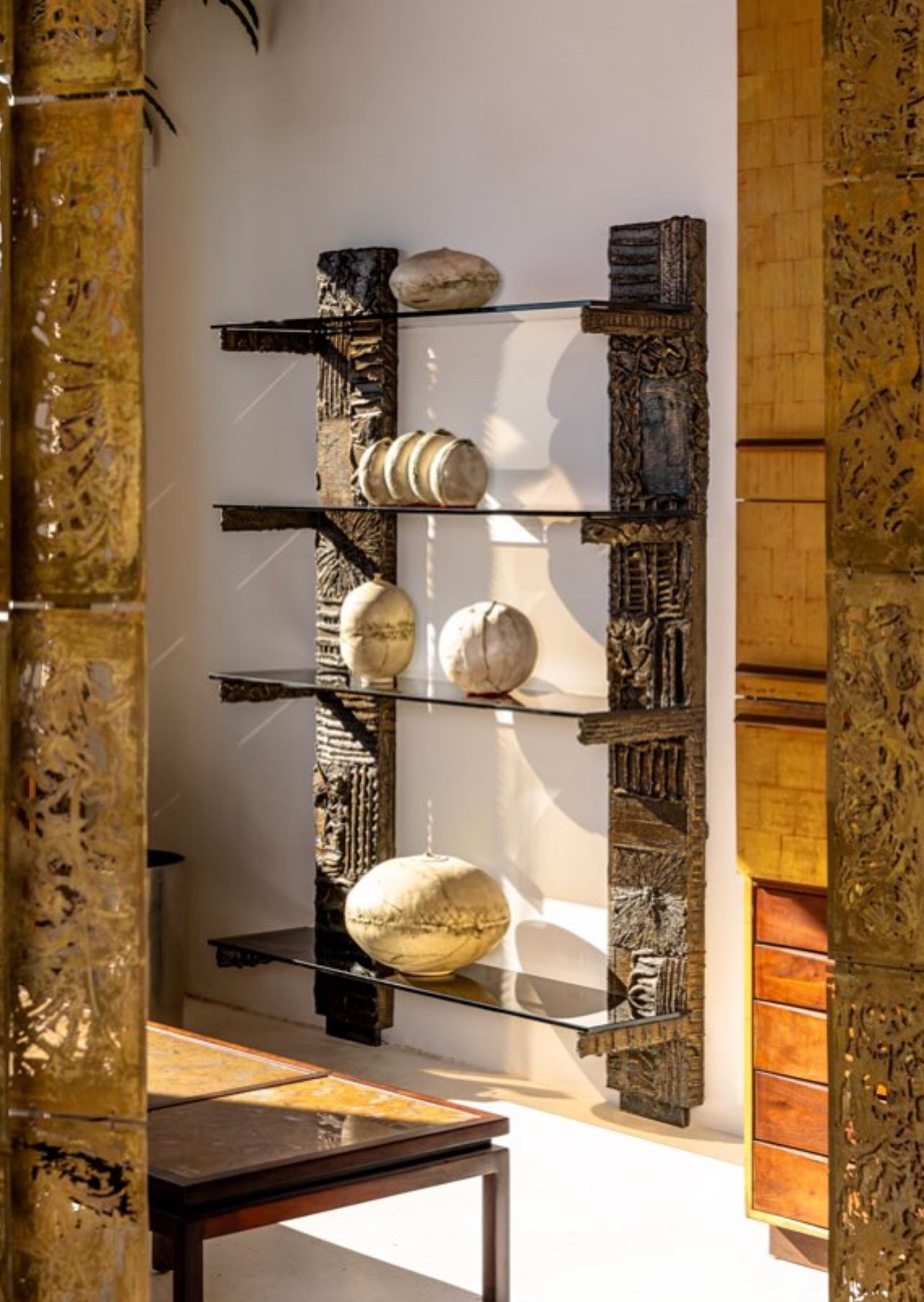 Paul Evans 'Sculpted Bronze Series' wall unit acquired from the original owner who acquired it from the Directional showroom in NYC. This unit is signed PE and is dated from the very first year of production, 1969. It is in very good original