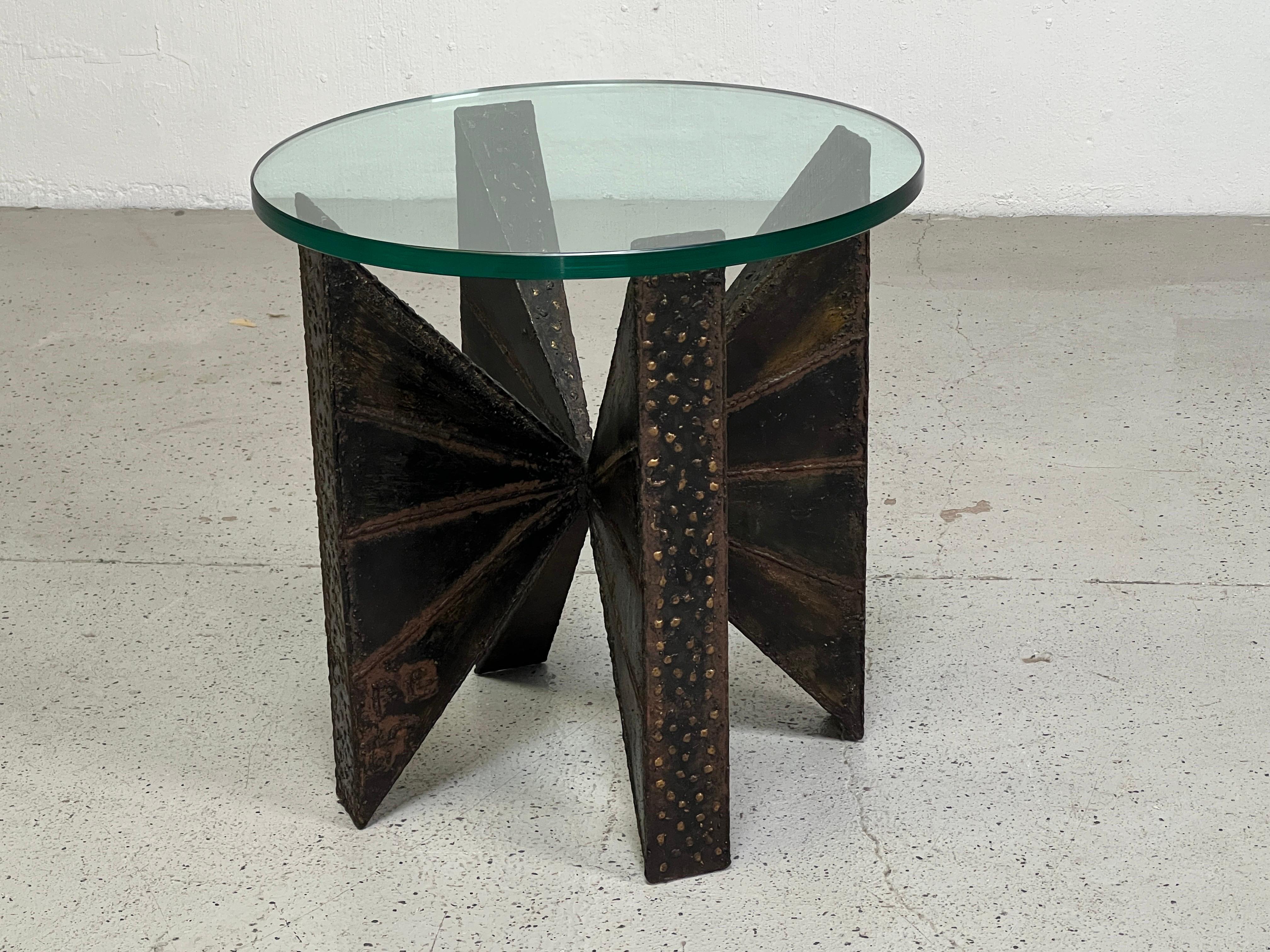 A sculpted metal side table designed by Paul Evans studio for Directional. Signed and dated 1967.