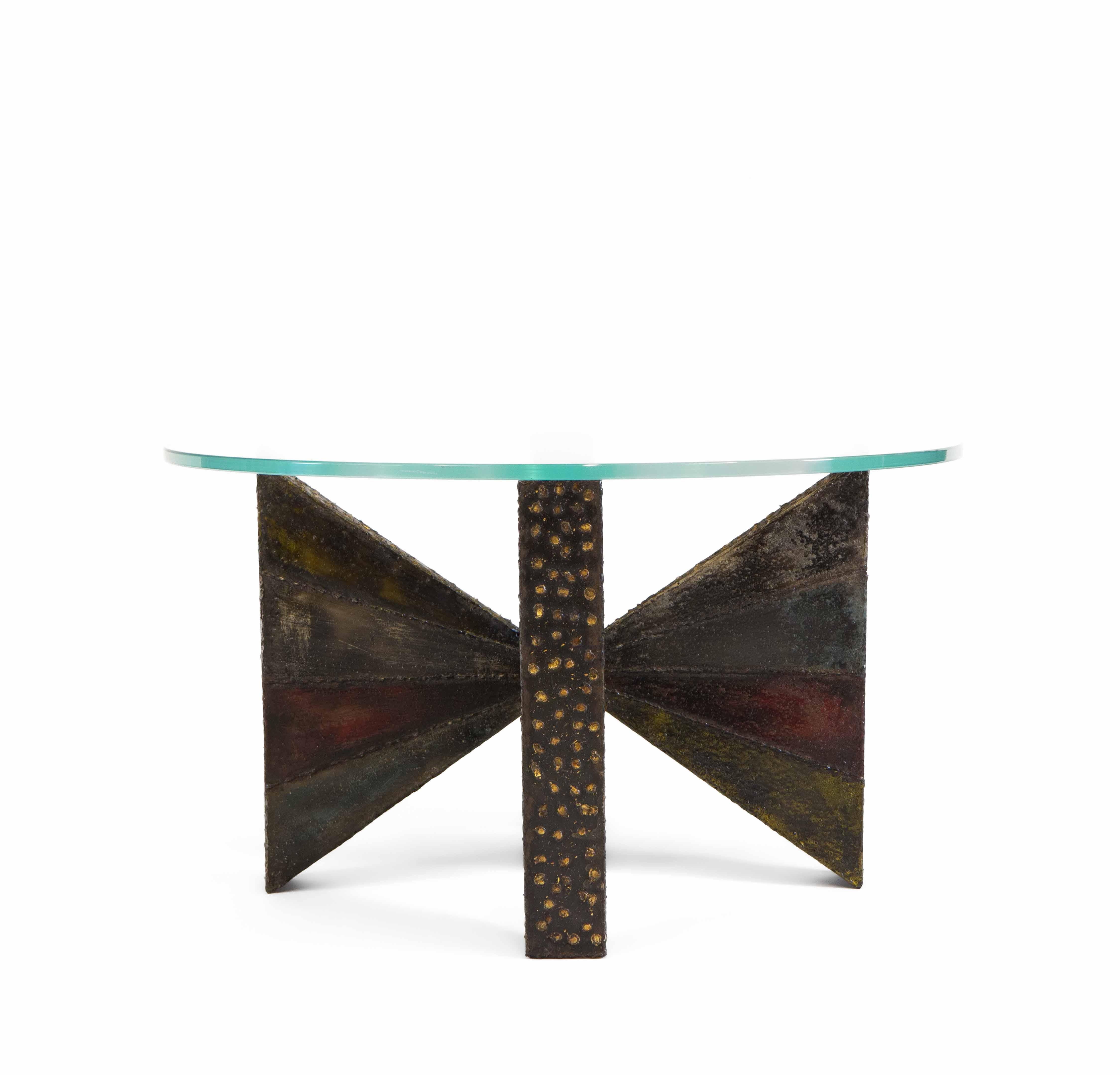 Sculpted steel coffee table by designer and sculptor Paul Evans (1931-1987) for Directional. USA 1967. Signed 'PE 67'.

Made of welded steel and polychrome, the table features artistic contrasting brazed brass decoration.

Paul Evans’