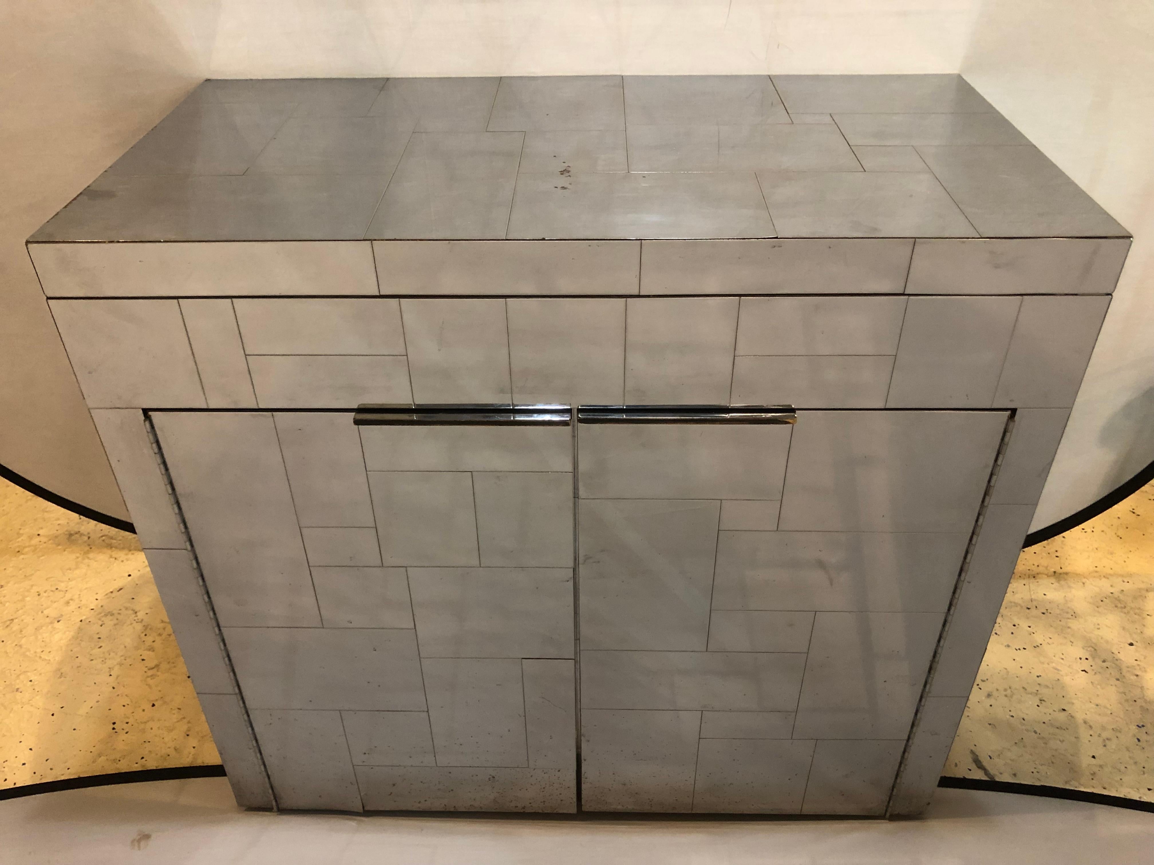 Paul Evans Signed Cityscape bar cabinet. PE 200 Series. For Directional 1975 chrome-plated Steel. Showing some signs of wear and tear as anyone would expect. The back missing one panel where a hole was placed to allow an electric cord inside.