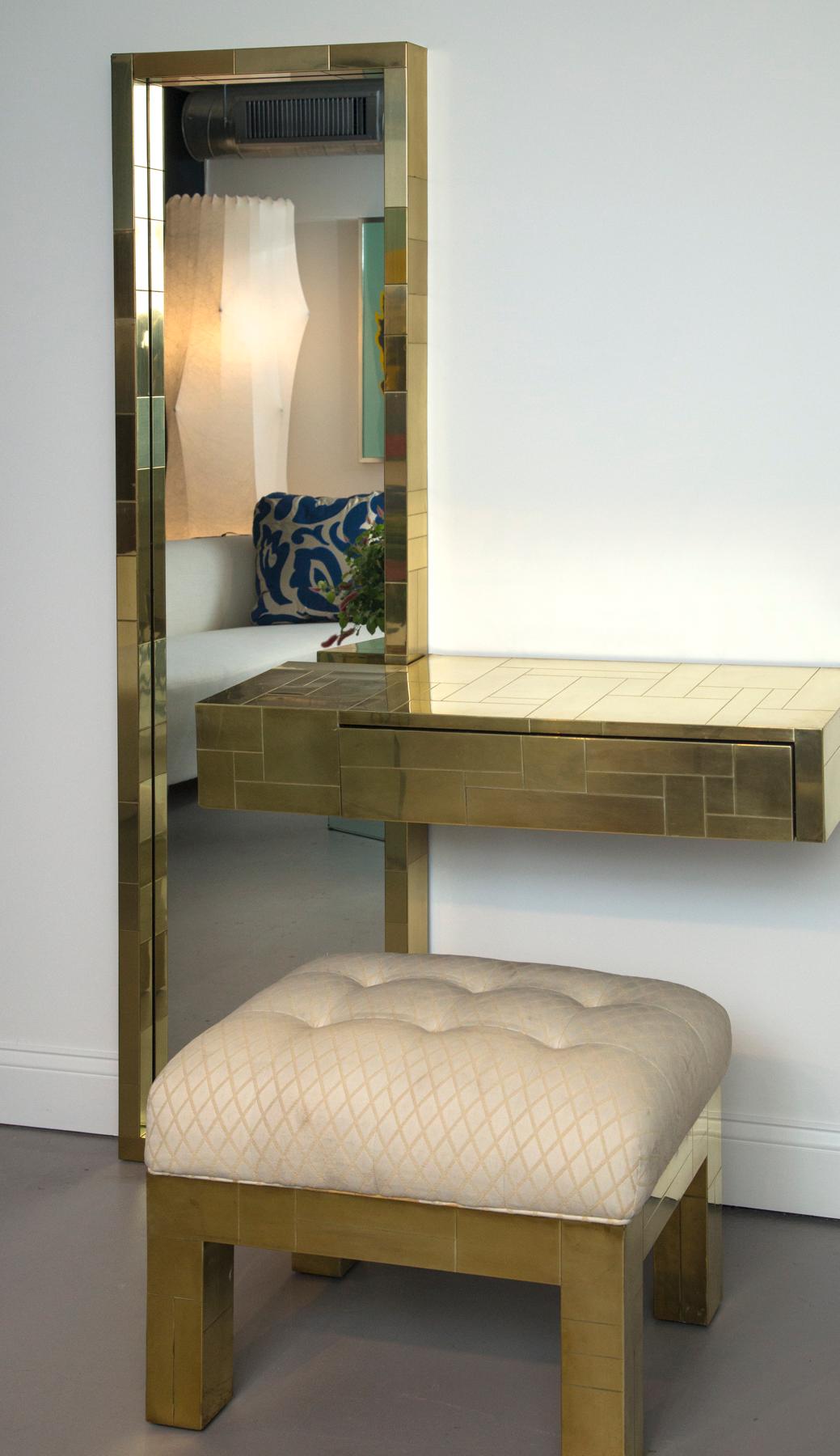 Paul Evans signed cityscape brass console with mirror and upholstered bench
Measures: Bench 17