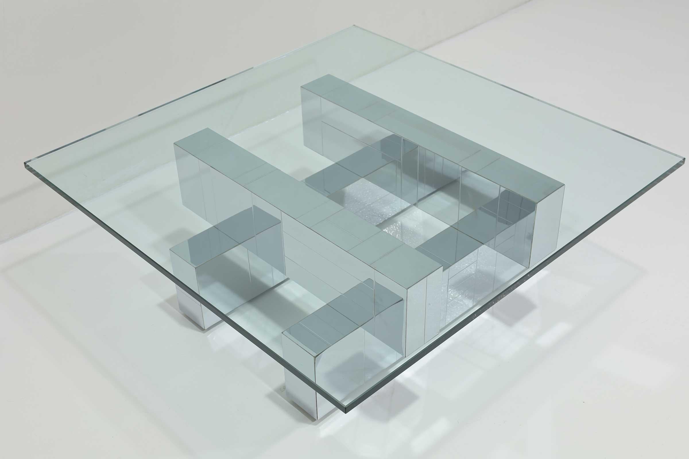 A Paul Evans for Directional Cityscape style cocktail/coffee table. This gorgeous midcentury modern coffee table is part of the legendary Paul Evans Cityscape series of furniture. This piece features a very thick square glass tabletop and a chrome