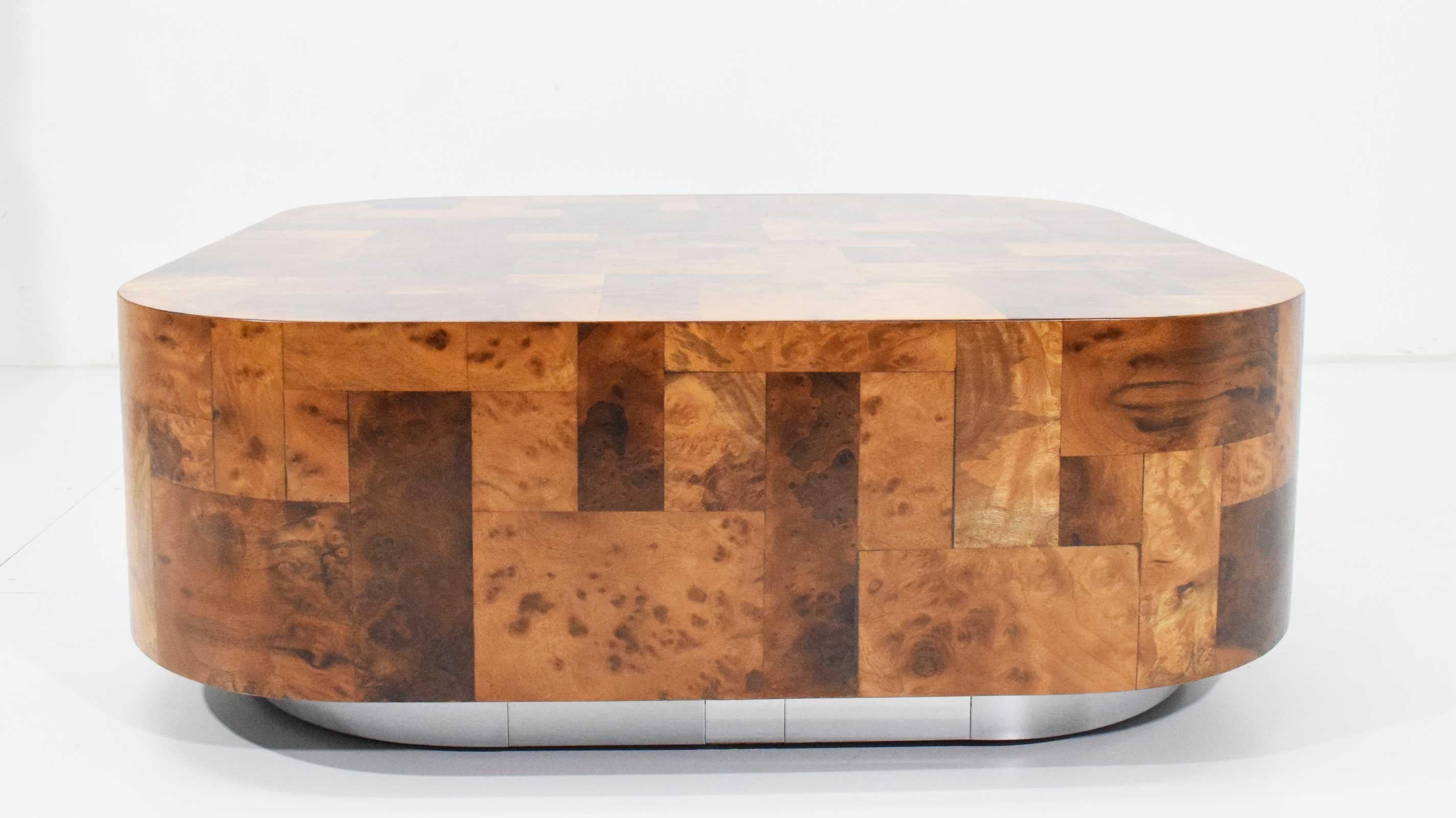 Beautiful restored cocktail table by Paul Evans. In burl wood with chrome base. Table is signed.