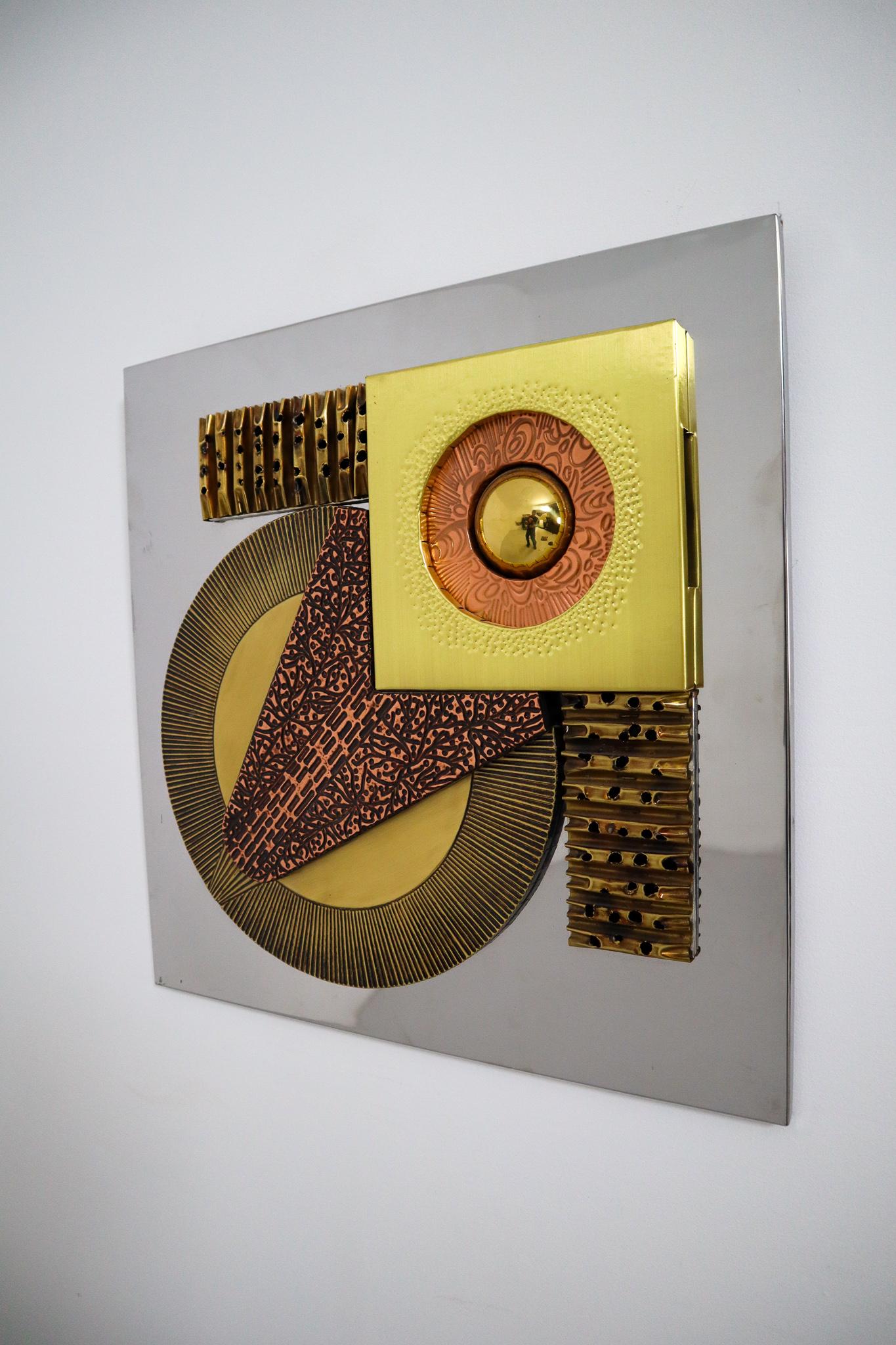 This brutalist wall sculpture is inspired and in the style of sculptor Paul Avans made approximately 1970, Europe . This abstract wall sculpture consist of tortured copper and brass in abstract shapes. The wall sculpture is affixed to a wood board