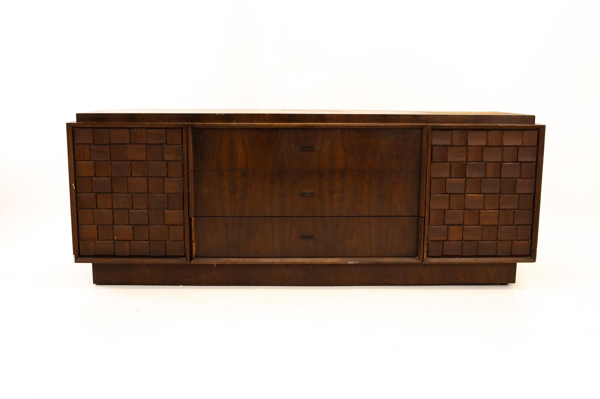 Paul Evans style Canadian Brutalist Mid Century walnut 9 drawer lowboy dresser

Dresser measures: 80 wide x 21 deep x 30.5 high

All pieces of furniture can be had in what we call restored vintage condition. That means the piece is restored upon