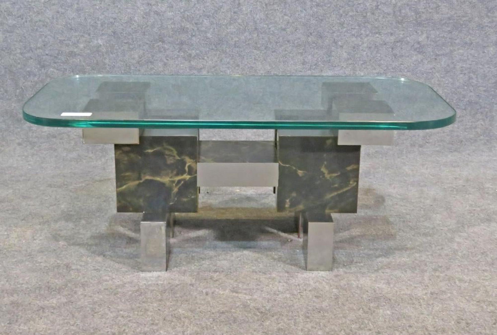 Mid-Century Modern table with city scape style chrome base and thick glass top.
(Please confirm item location - NY or NJ - with dealer).
 