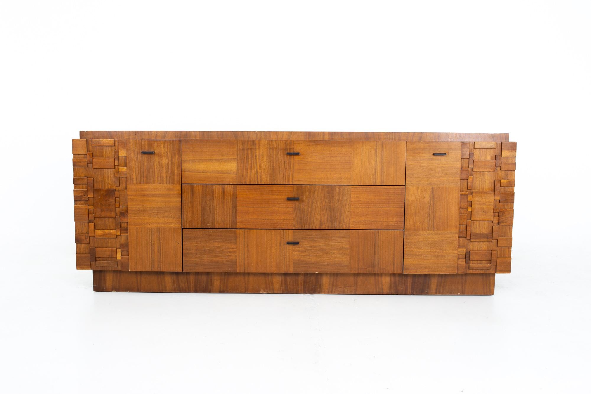 Paul Evans style Lane Brutalist mid century walnut 9 drawer lowboy dresser

Dresser measures: 80 wide x 20.25 deep x 30.25 inches high

All pieces of furniture can be had in what we call restored vintage condition. That means the piece is