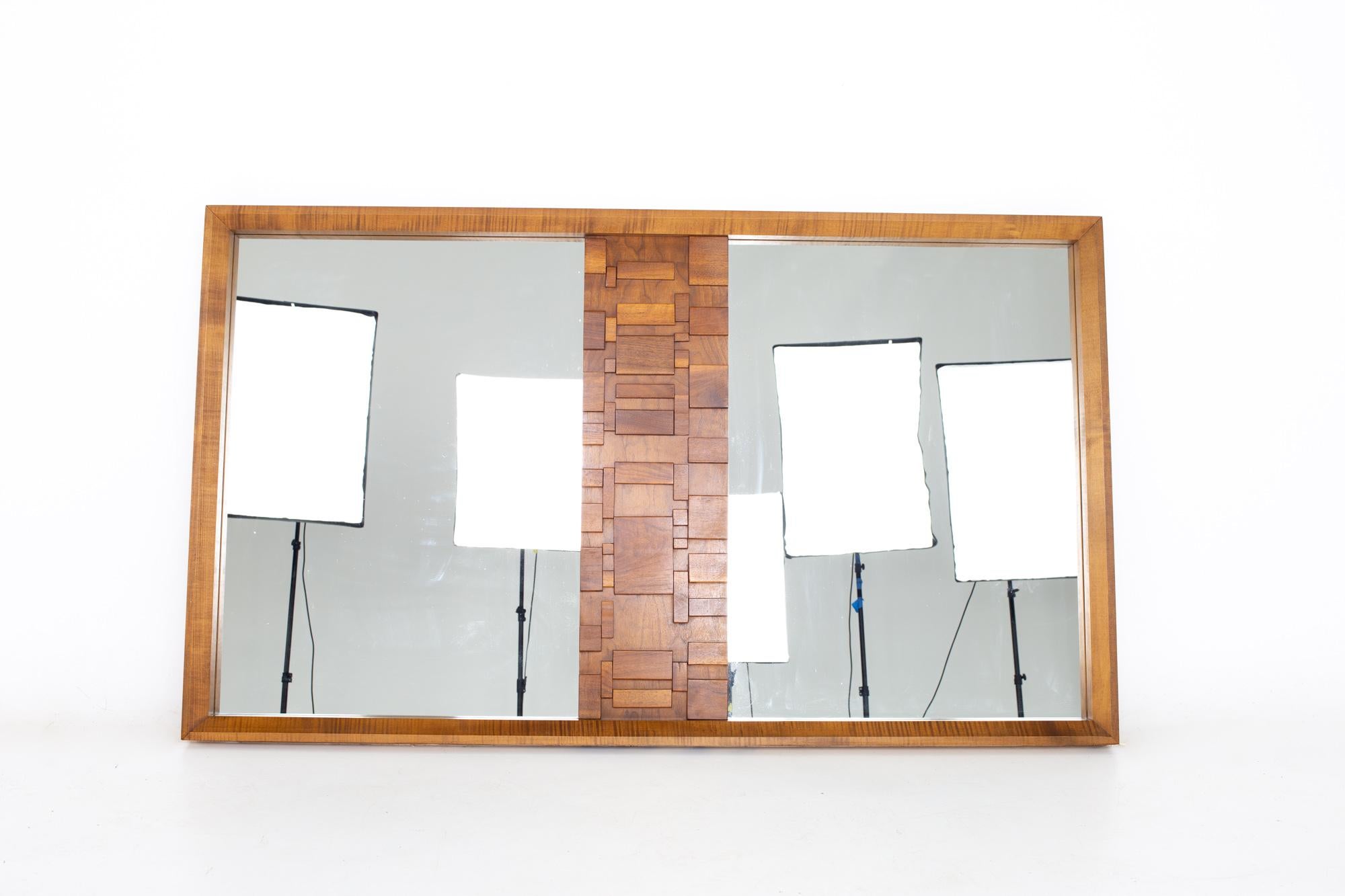 Paul Evans style lane Brutalist mid century walnut mirror

Mirror measures: 62.5 wide x 2 deep x 36.5 inches high

All pieces of furniture can be had in what we call restored vintage condition. That means the piece is restored upon purchase so