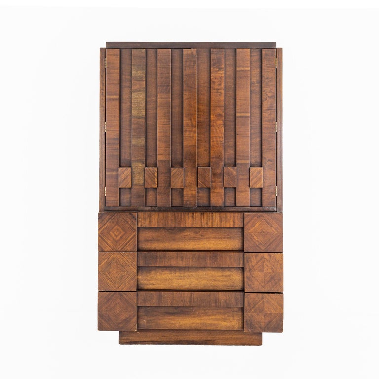 Paul Evans style lane mid century walnut Brutalist armoire

The armoire measures: 38 wide x 19 deep x 64 inches high

All pieces of furniture can be had in what we call restored vintage condition. That means the piece is restored upon purchase