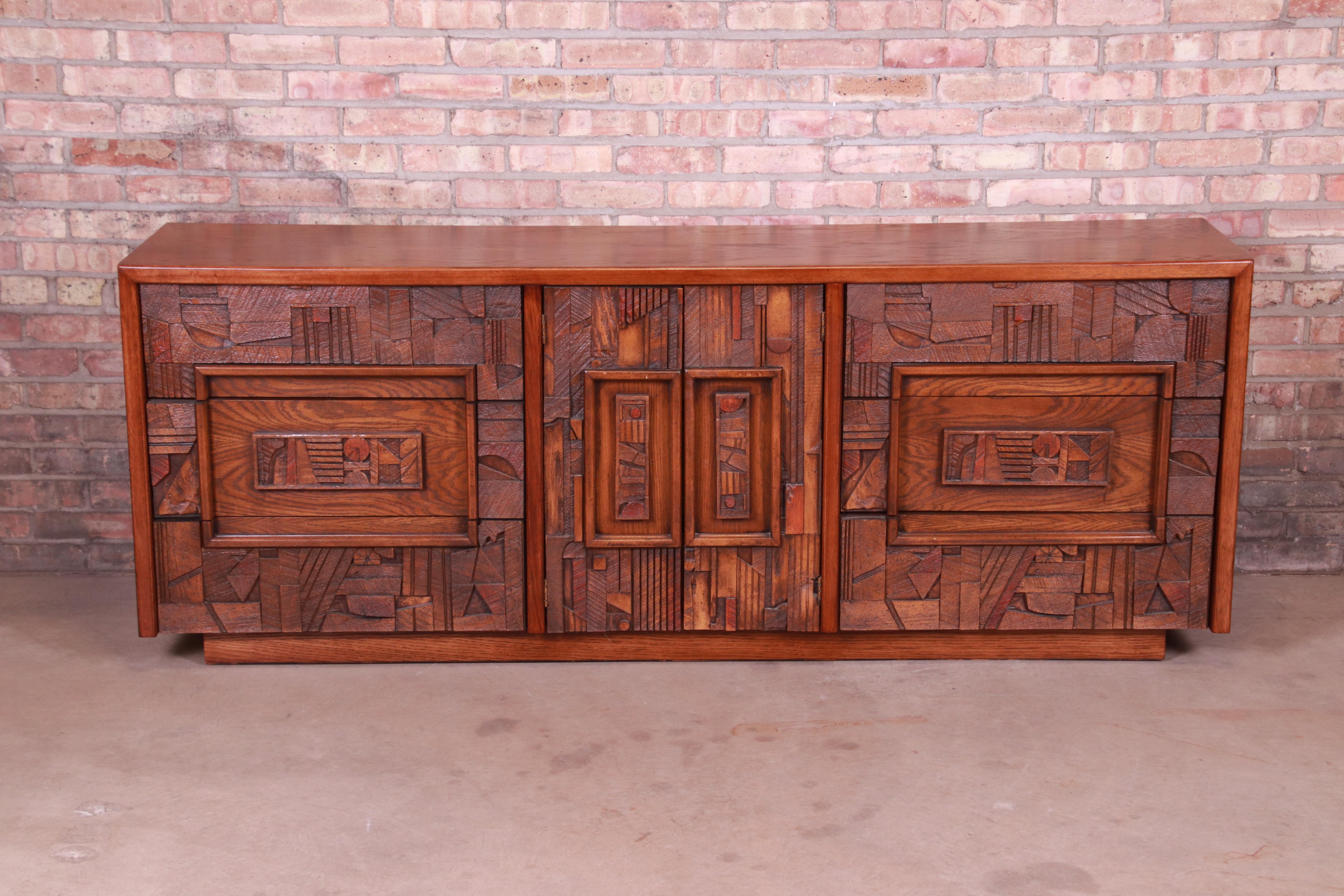 An exceptional Paul Evans style Mid-Century Modern Brutalist oak long dresser or credenza

By Lane Furniture 