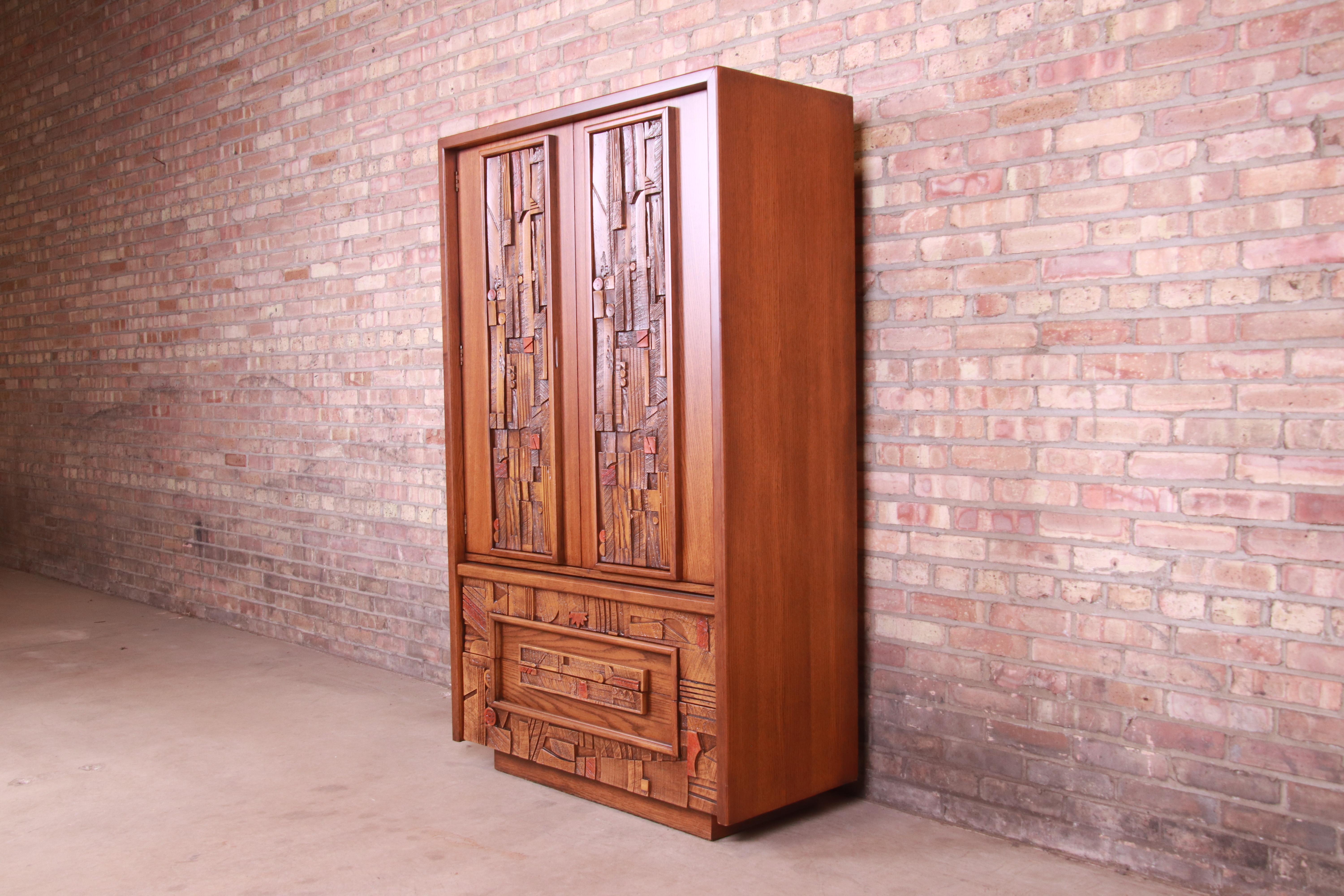 An exceptional Paul Evans style Mid-Century Modern brutalist oak armoire dresser

By Lane Furniture, 