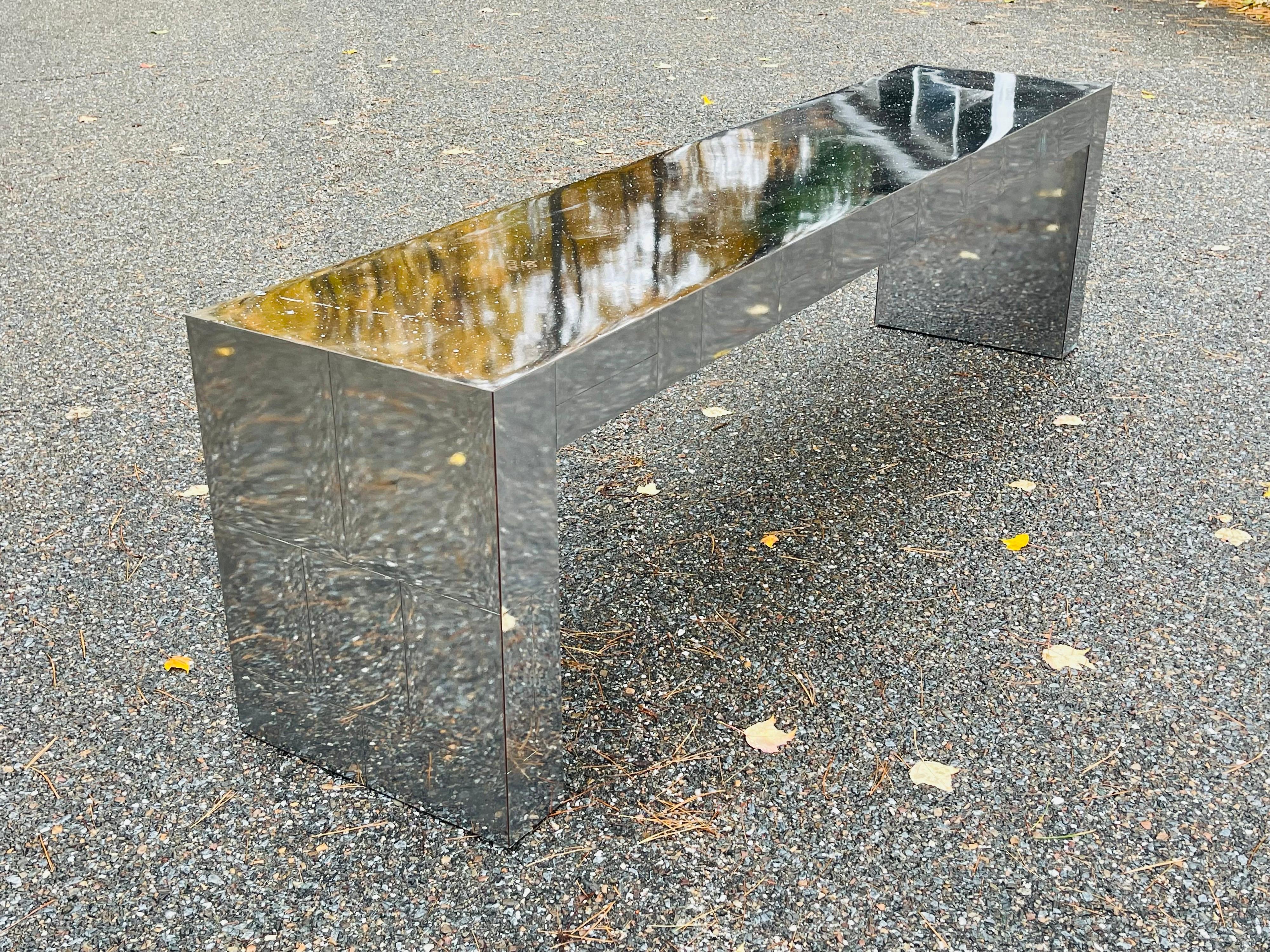 Wonderful long mirrored console table in style of Paul Evans Cityscape makes a unique display shelf in a variety of interiors. Cityscape design makes this patchwork mirrored shelf perfect for storage, display, or accent in foyer, hall, or showroom.