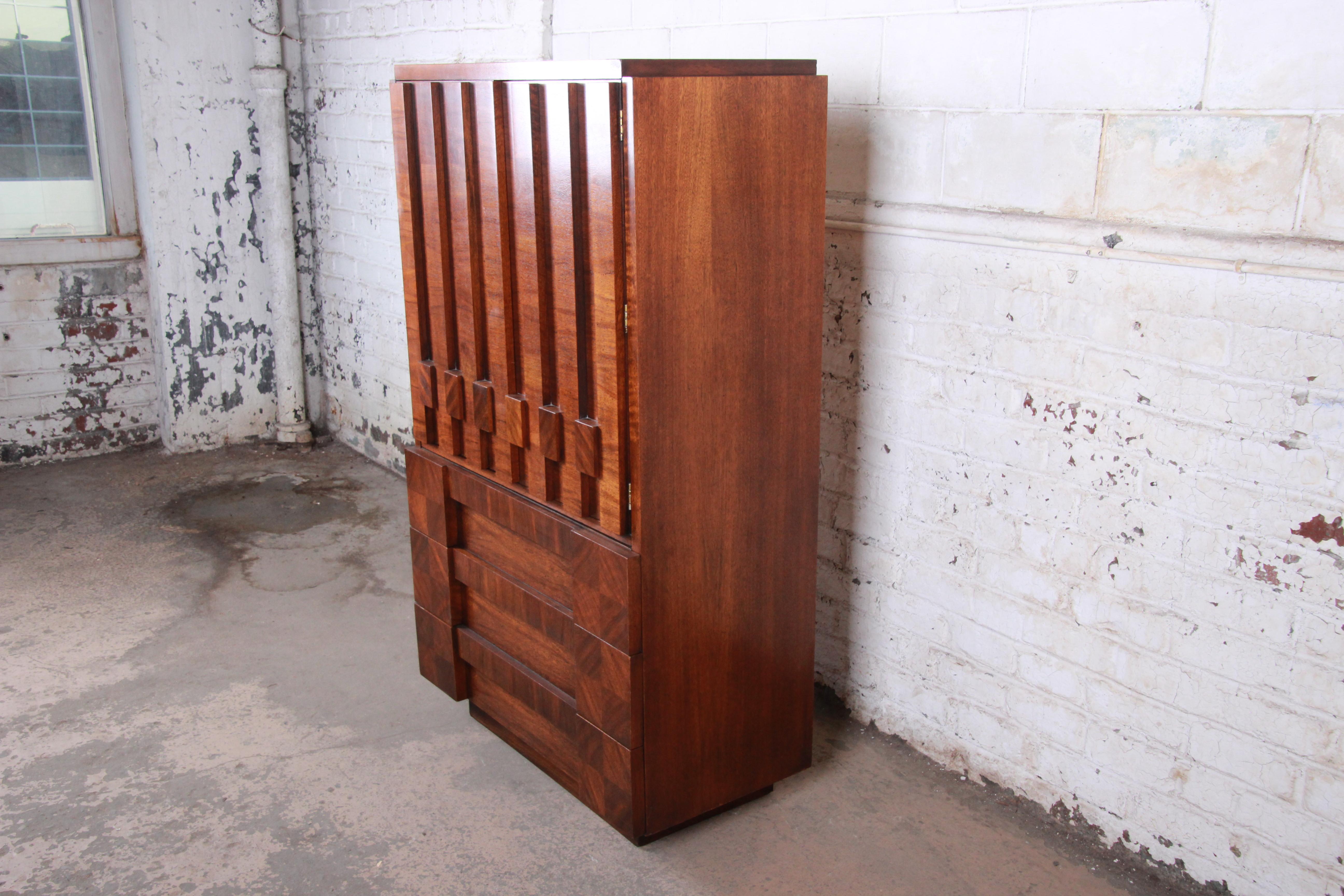 A gorgeous Paul Evans style Mid-Century Modern Brutalist walnut gentleman's chest or armoire dresser

By Lane Furniture 