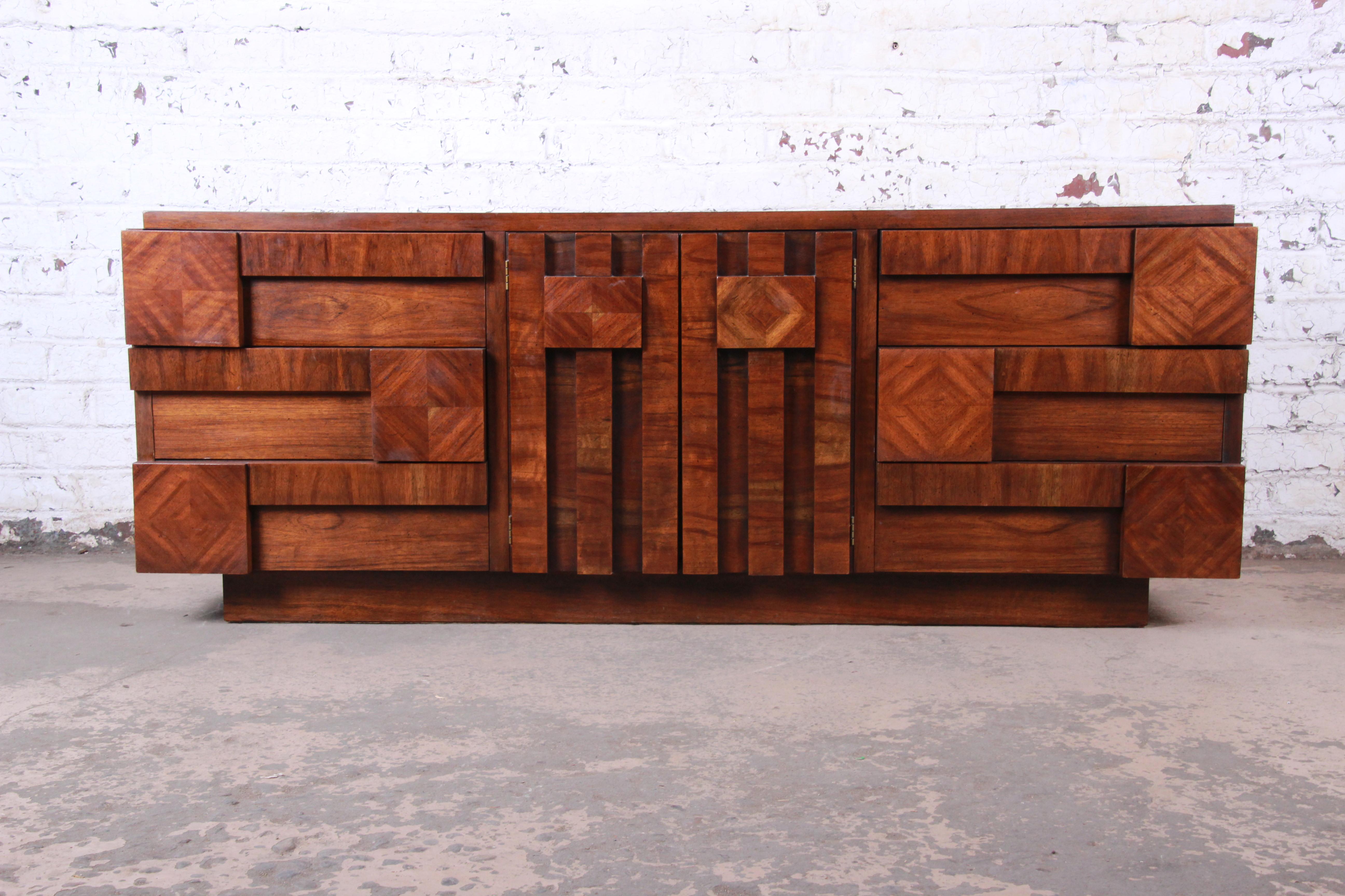 A gorgeous Paul Evans style Mid-Century Modern Brutalist walnut long dresser or credenza

By Lane Furniture 