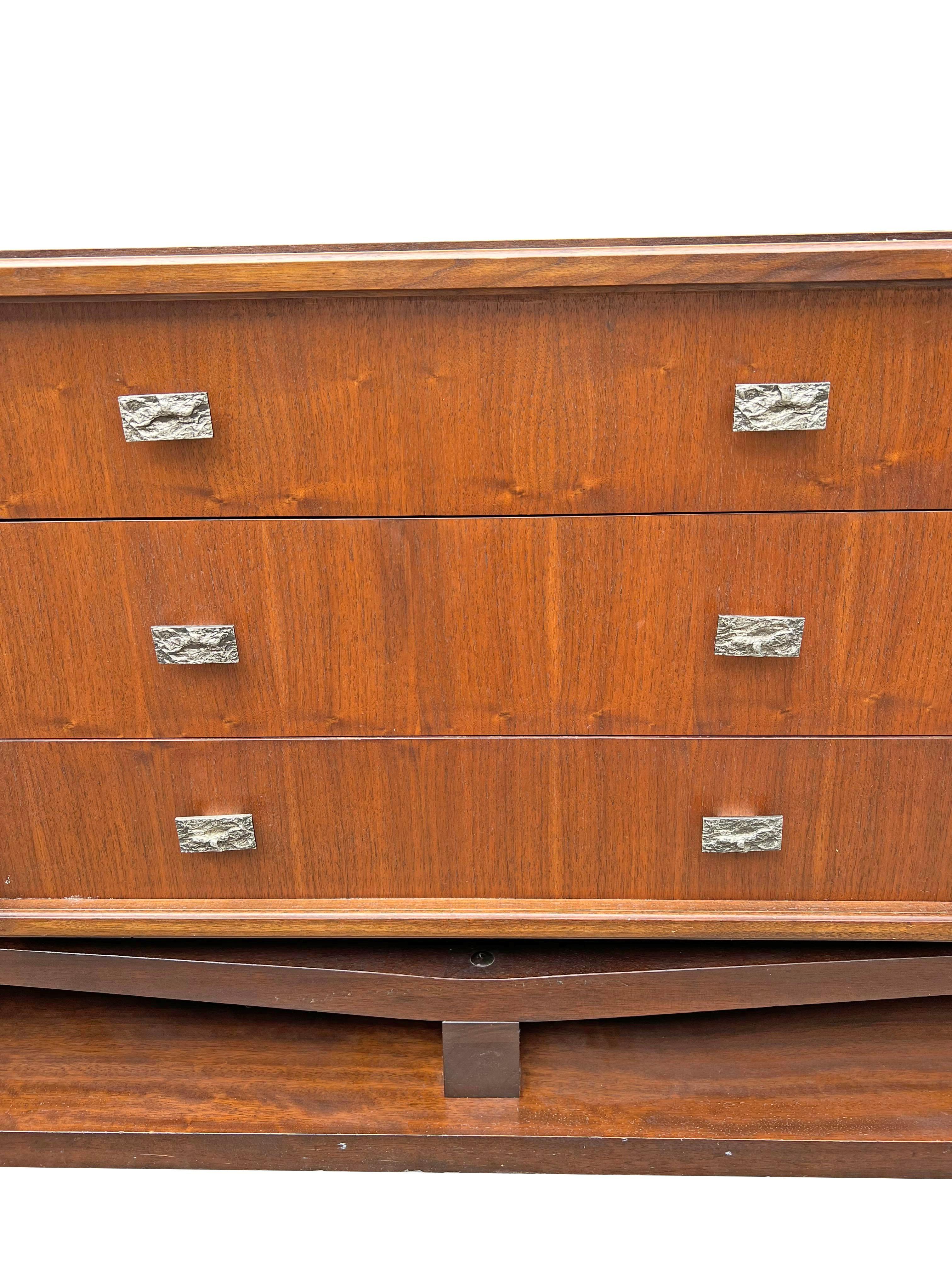 Paul Evans Style Modern Sculpted Floating Tall Dresser in Brutalist Style.

Elevate your bedroom with this stunning Paul Evans Style Modern Sculpted Floating Tall Dresser. This unique piece combines form and function with a bold, Brutalist