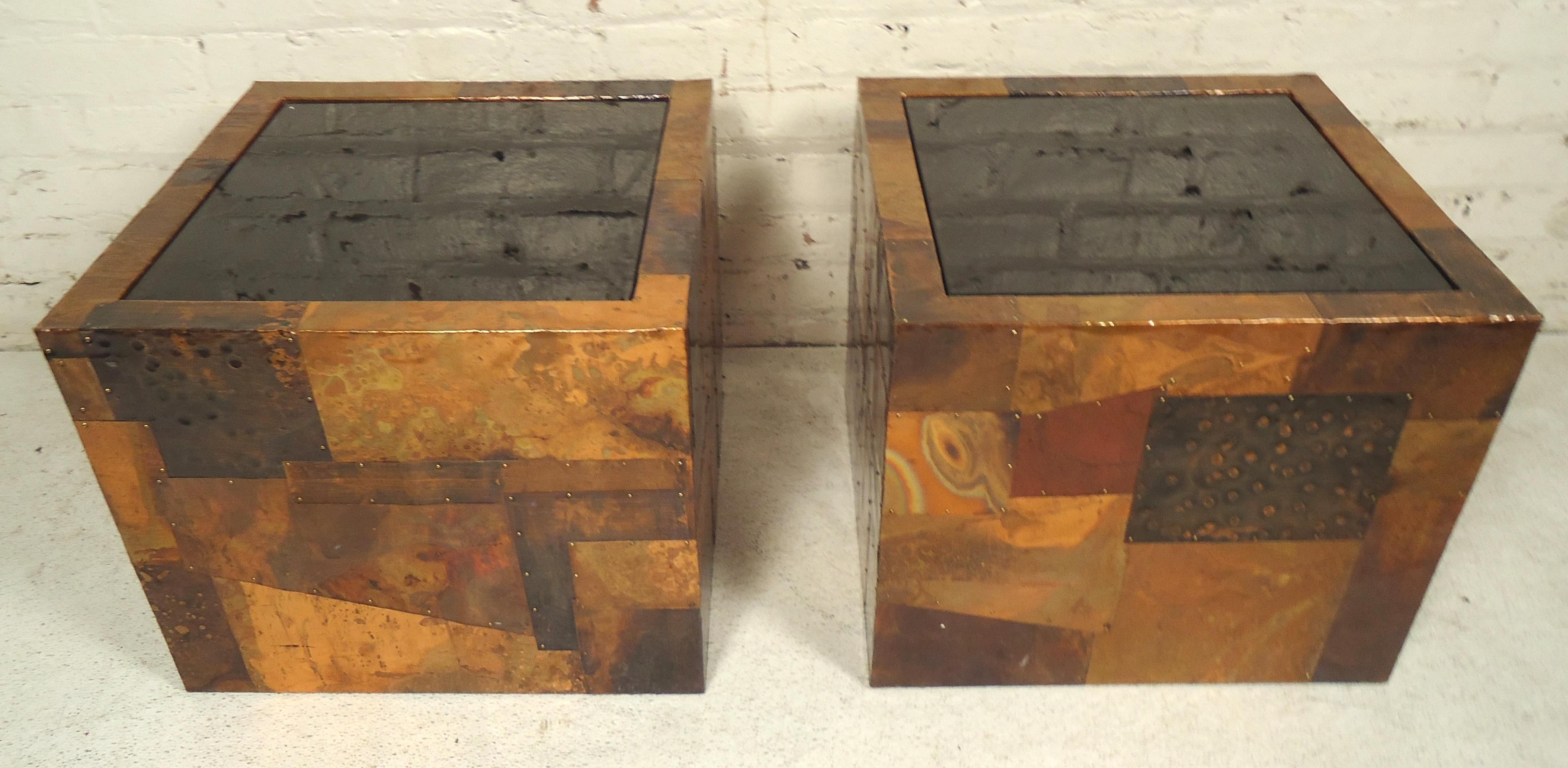 Striking mixed metal side tables with black tinted glass tops. Hammered metal sheets in a patchwork Brutalist style.

(Please confirm item location, NY or NJ-with dealer).
 