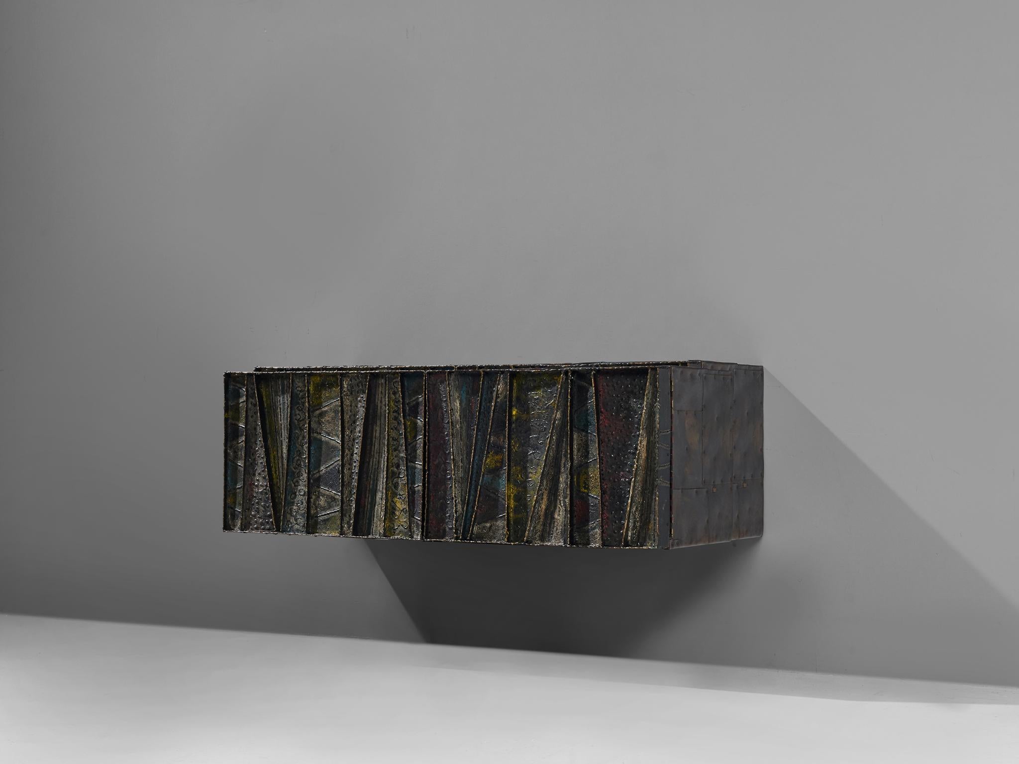 Paul Evans for Paul Evans Studio, deep relief, wall-mounted sideboard model PE-19, welded and patinated steel and darkened wood, United States, circa 1972

Paul Evans 'Deep Relief’ wall-mounted cabinet with welded and patinated steel doors in