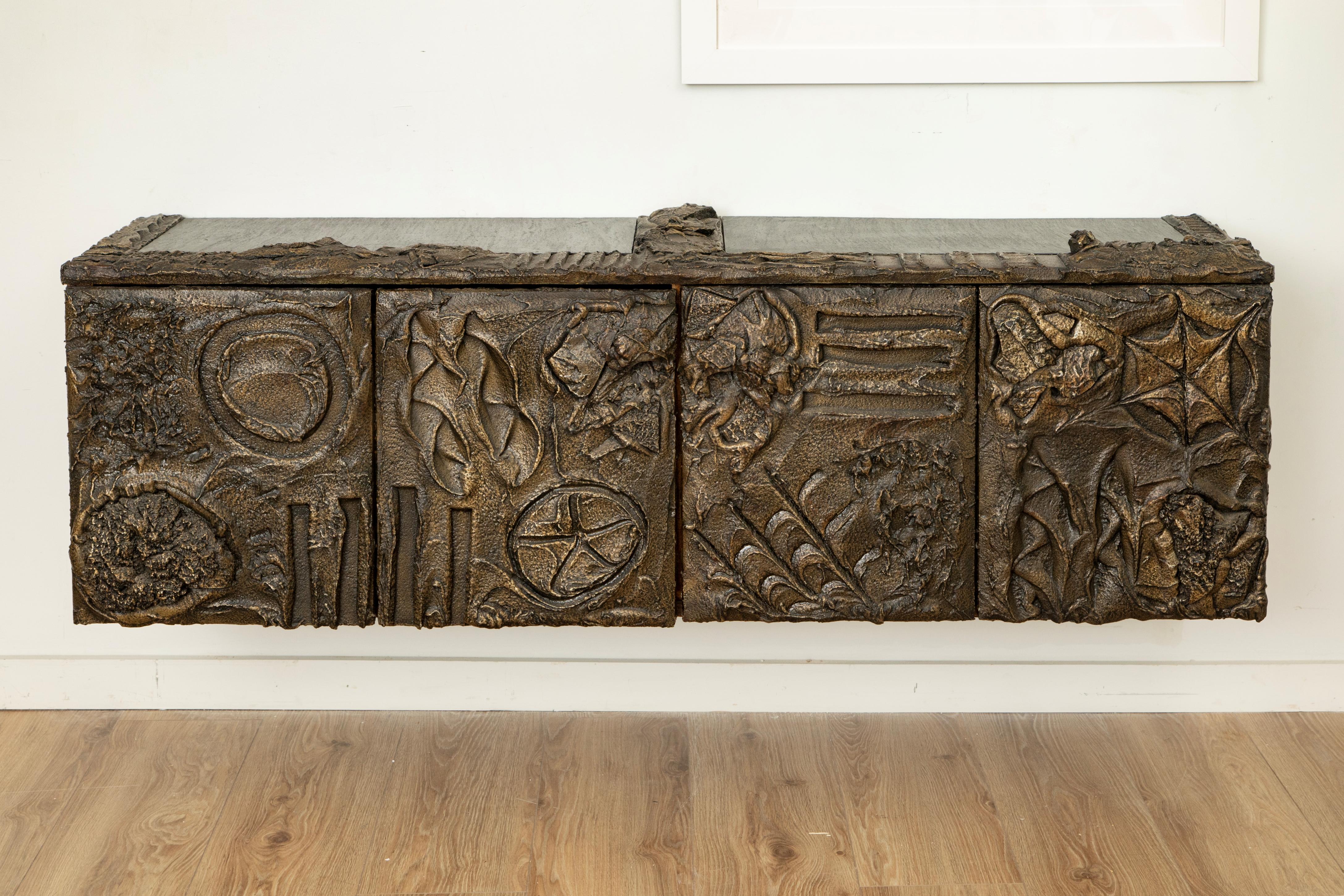 Paul Evans Wall Mounted Sculpted Bronze Brutalist Sideboard, USA, 1969
An exceptional example from Paul Evans’ iconic sculpted bronze series, this brutalist sideboard was created in 1969 by the artist’s studio for Directional Furniture. The piece is