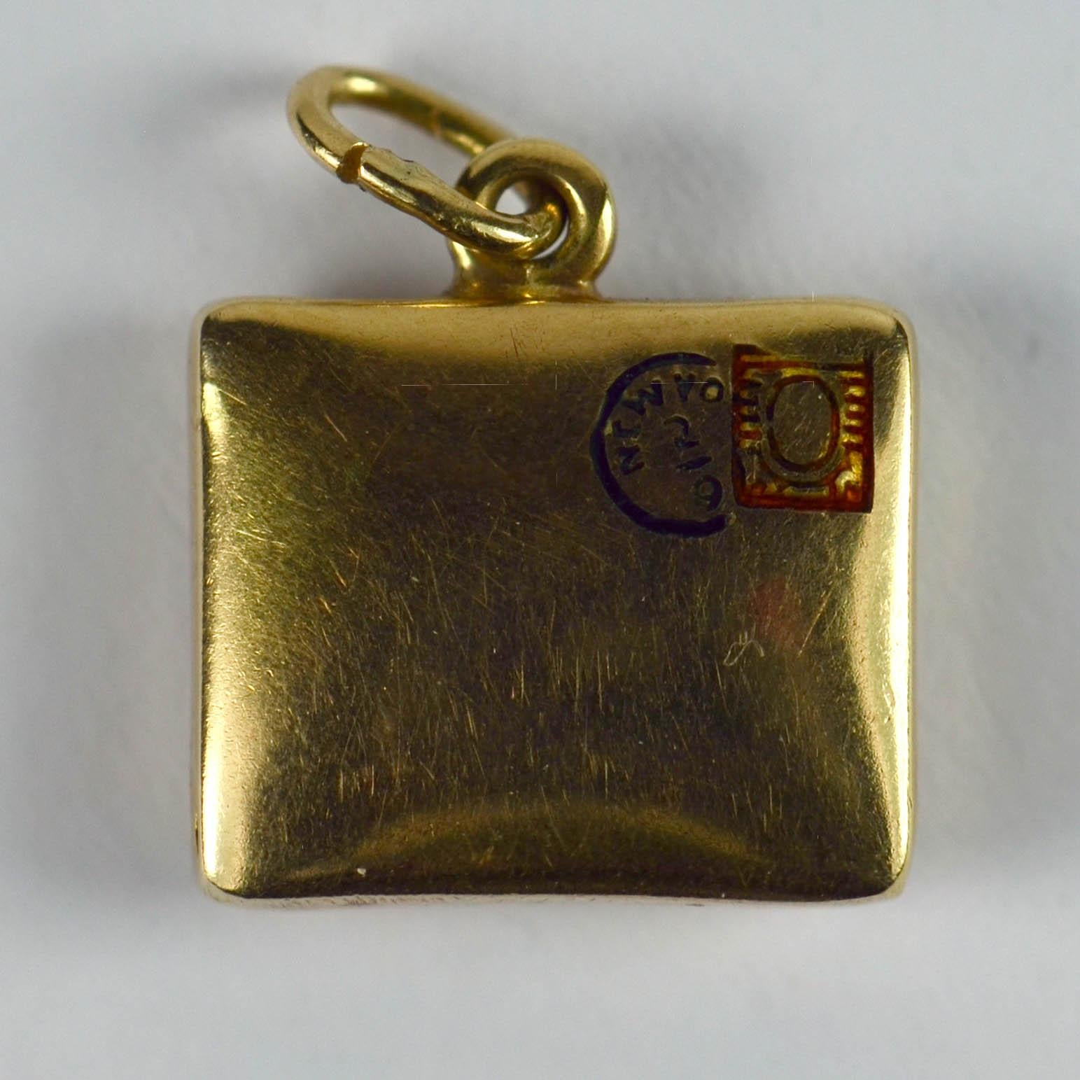 A 14 karat yellow gold charm pendant designed as a sealed envelope with enamel postmarks for New York. Marked 14K with abraded marks to the jump ring. Attributed to Paul Flato whose line of envelopes and parcels are well known, and usually bore the