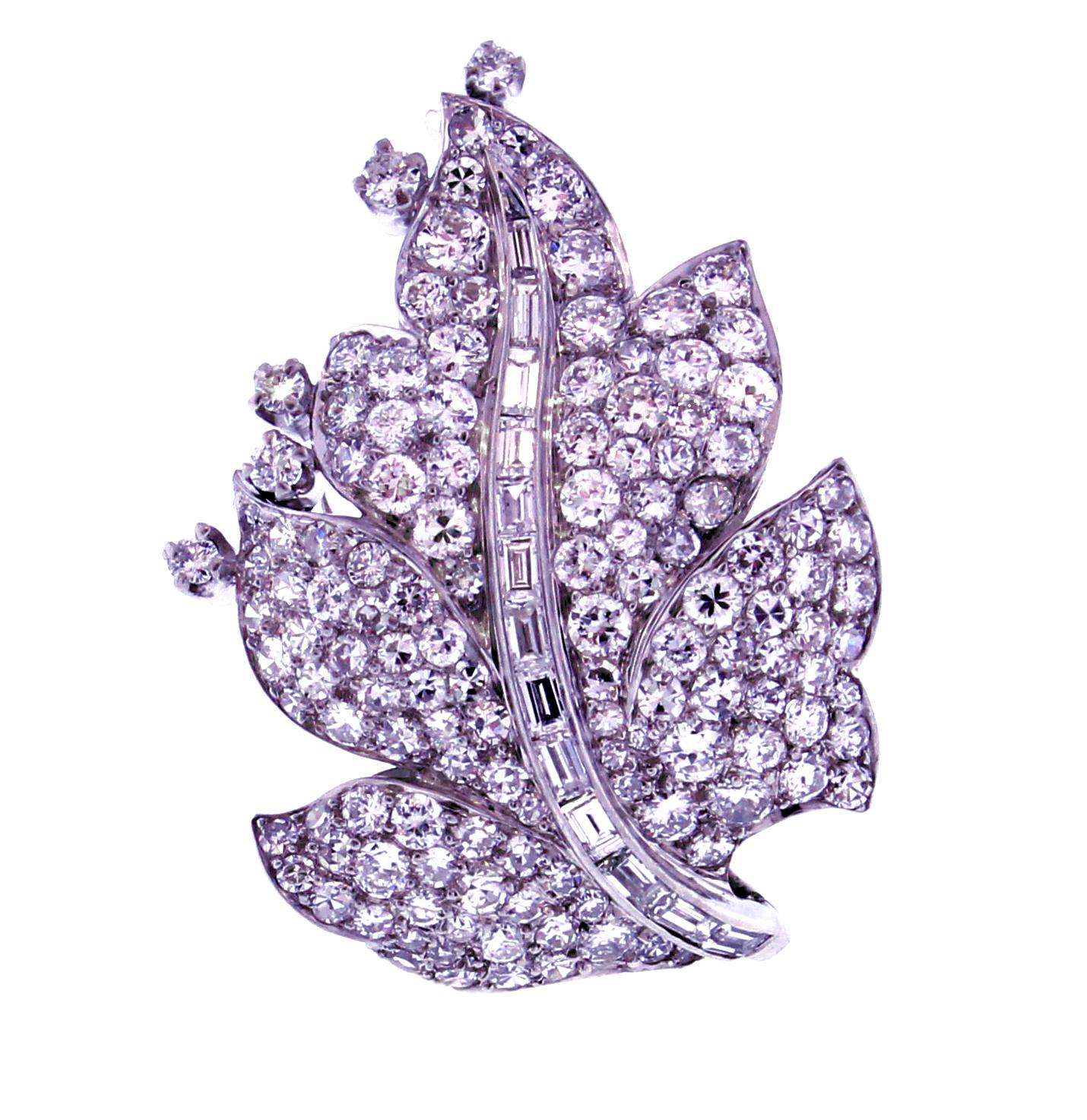 From Paul Flato, an elegant diamond leaf brooch. The platinum  brooch is comprised of 250 round diamonds weighing approximately 2.50 carats and 14 baguette cut diamonds weighing approximately .50 carats. 1 5/8 by 1 inch.  May also be worn as a