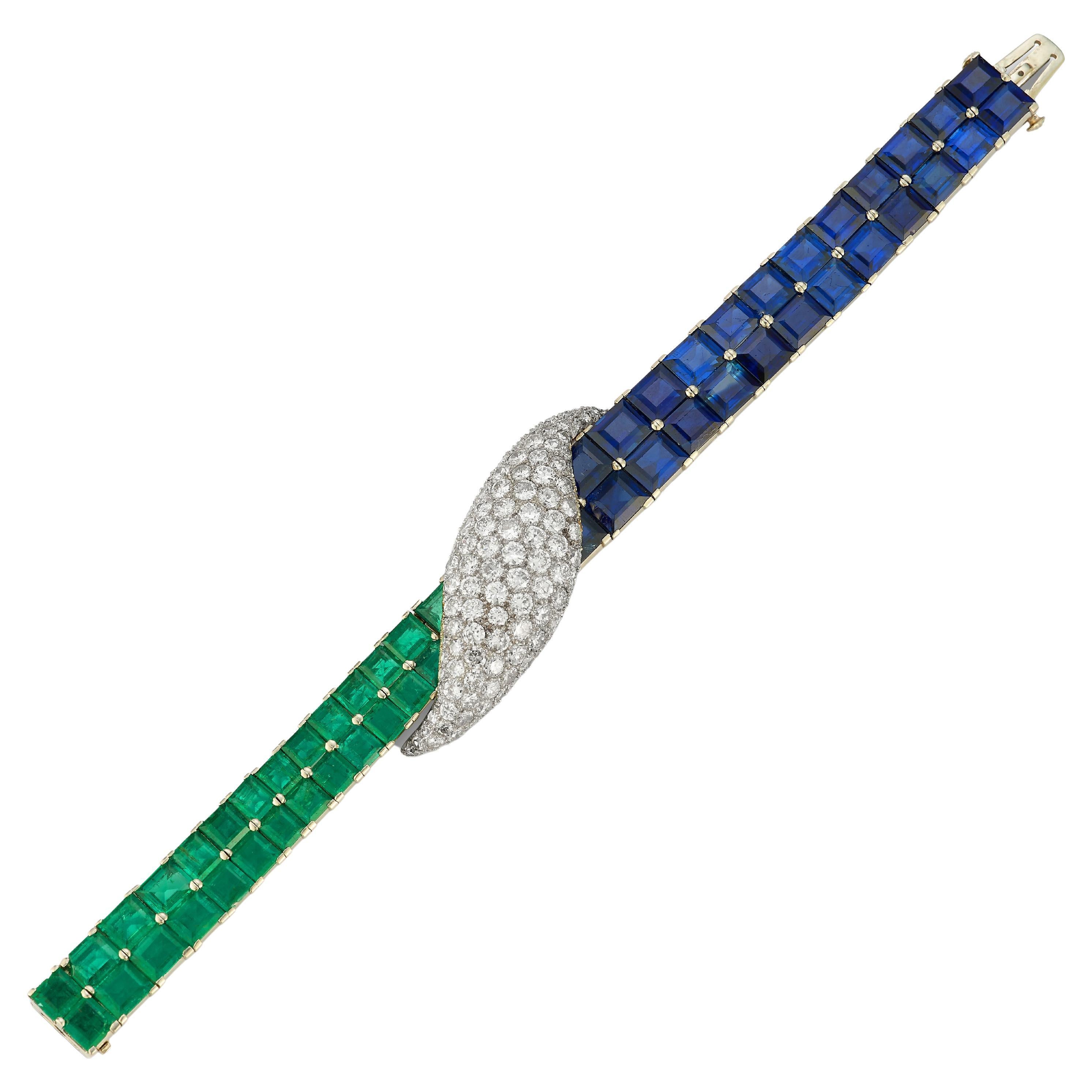 Paul Flato Multi Gem & Diamond Bracelet & Earrings Set 

The earrings are made of platinum and set with 12 sapphires, 12 emeralds and round cut diamonds

The bracelet is made of platinum and set with 27 emeralds, 25 sapphires and round cut diamonds