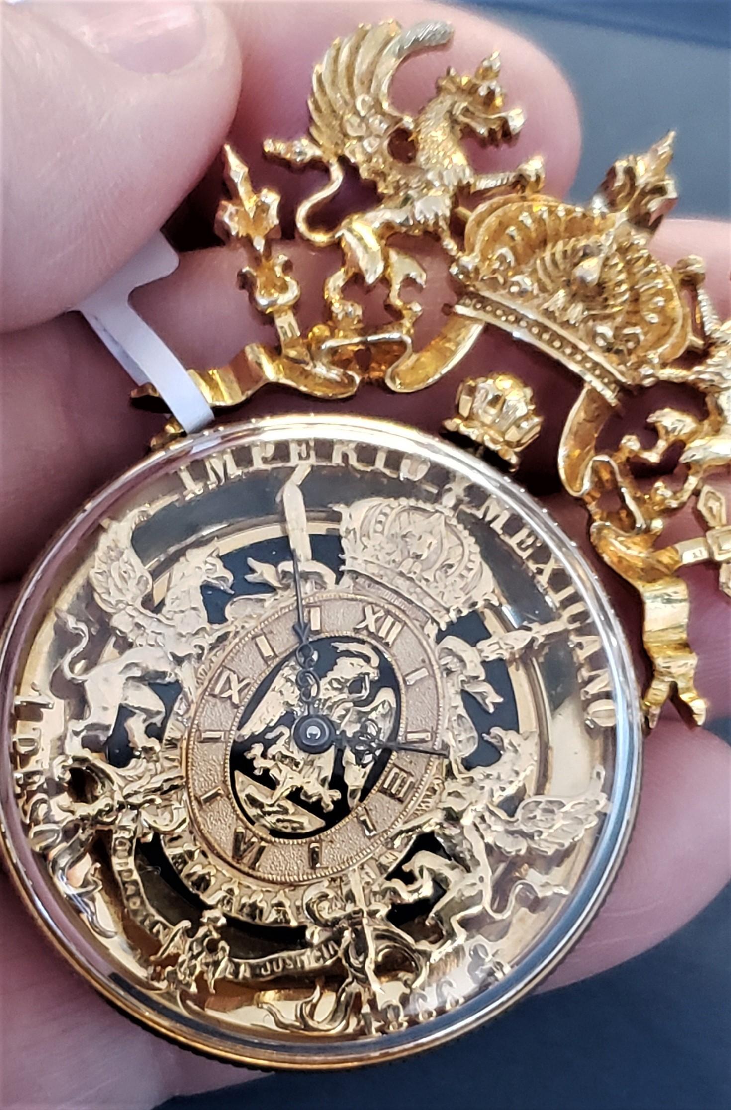 Paul Flato Imperio Mexicano 1866 Ein Peso Uhr/Anhänger 18K 44,4g


Die Uhr wurde am 24. Januar 2024 von einem zertifizierten Uhrmacher geliefert. Mechanisches Uhrwerk mit manuellem Aufzug - alles in Ordnung. Alle goldenen Details sind in sehr gutem