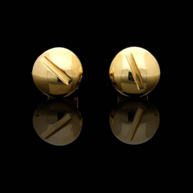 A whimsical pair of 18 carat yellow gold ‘Nut & Bolt’ cufflinks by Paul Flato c.1960s, each designed as a large bolt with slotted domed circular head and threaded stem with removable square nut which acts as the fastener, with original red leather