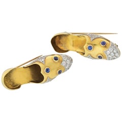 Paul Flato Platinum & 14k Yellow Gold Diamond and Sapphire Pair of Shoe Clip Bro